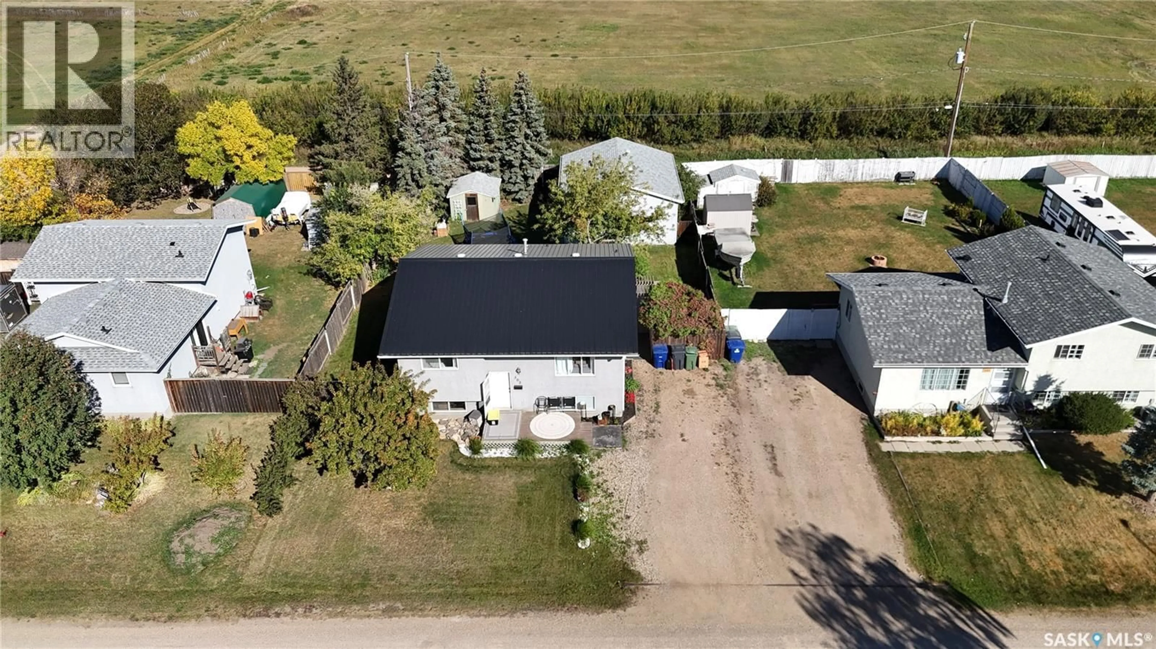 A pic from outside/outdoor area/front of a property/back of a property/a pic from drone, street for 303 4TH STREET, Dundurn Saskatchewan S0K1K0