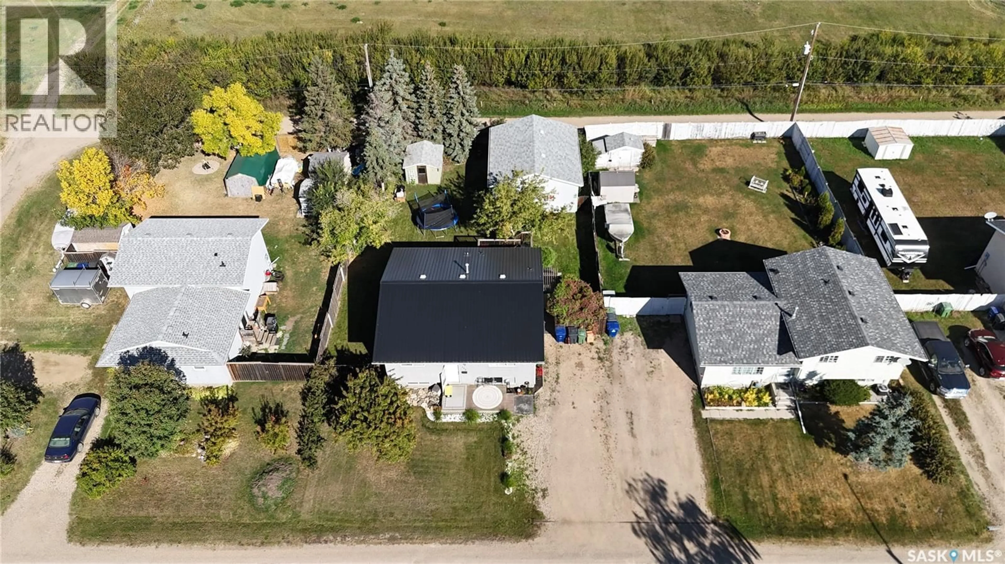A pic from outside/outdoor area/front of a property/back of a property/a pic from drone, street for 303 4TH STREET, Dundurn Saskatchewan S0K1K0