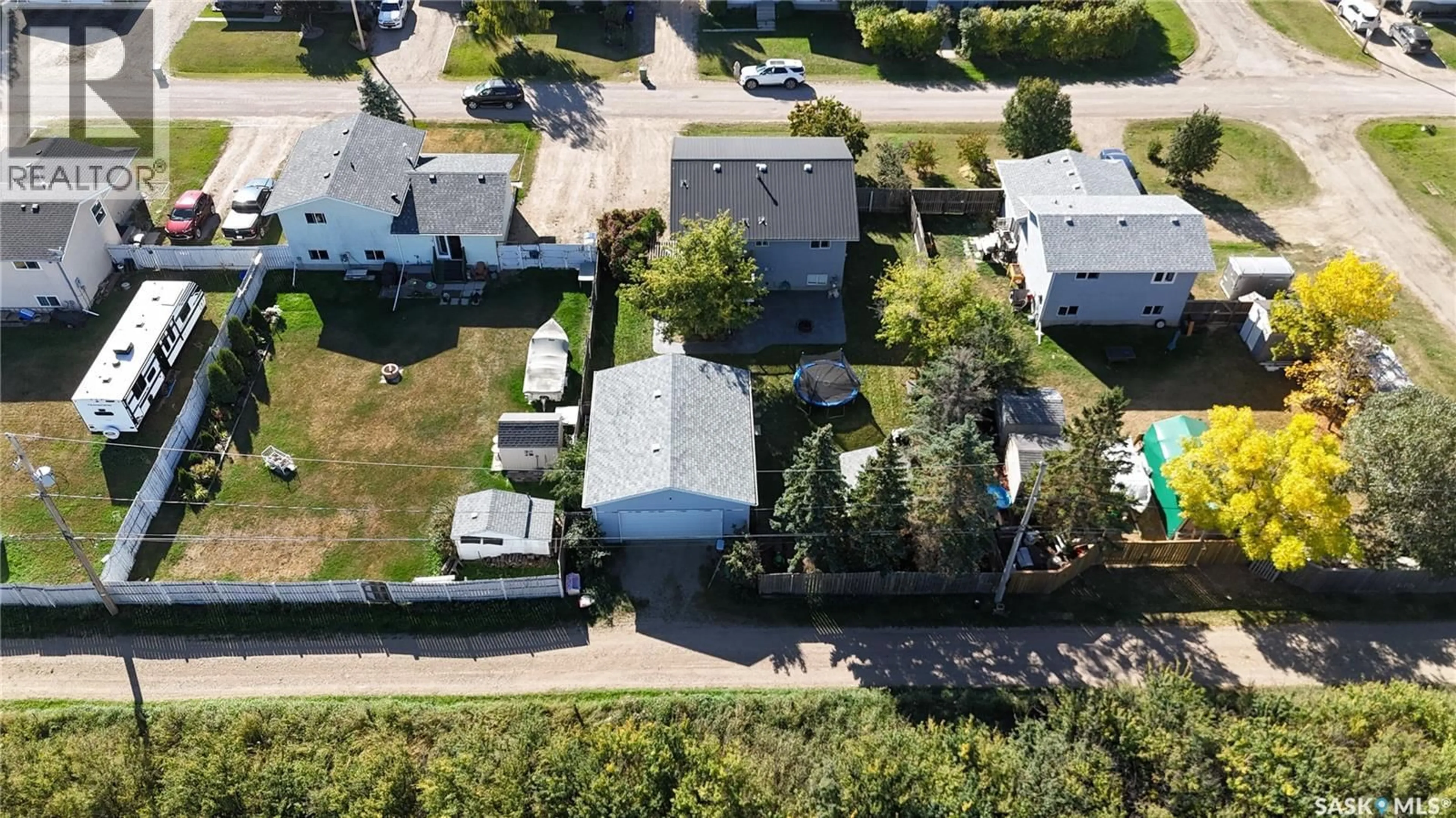 A pic from outside/outdoor area/front of a property/back of a property/a pic from drone, street for 303 4TH STREET, Dundurn Saskatchewan S0K1K0