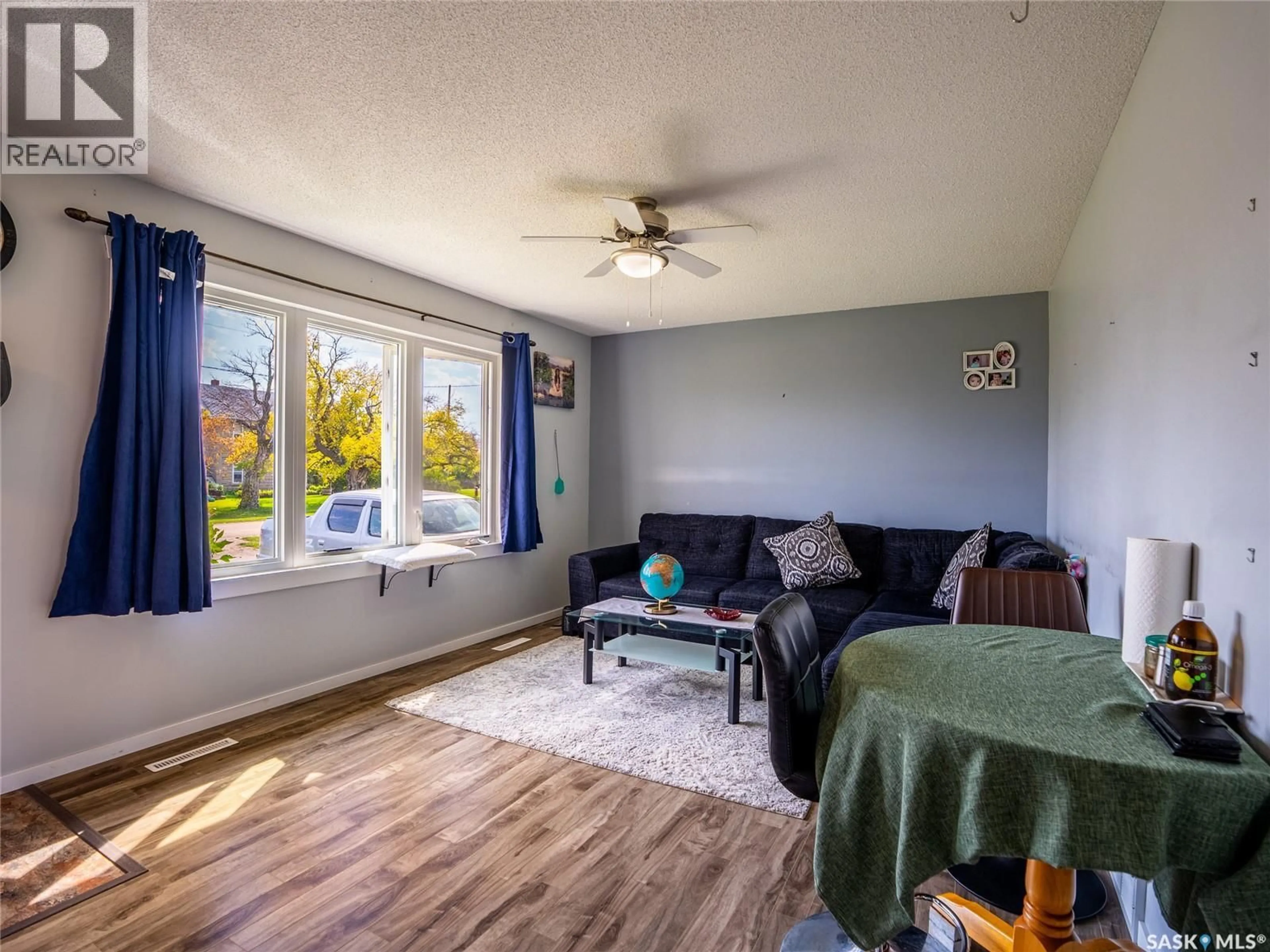 Living room with furniture, wood/laminate floor for 310 MAIN STREET, Abernethy Saskatchewan S0A0V0