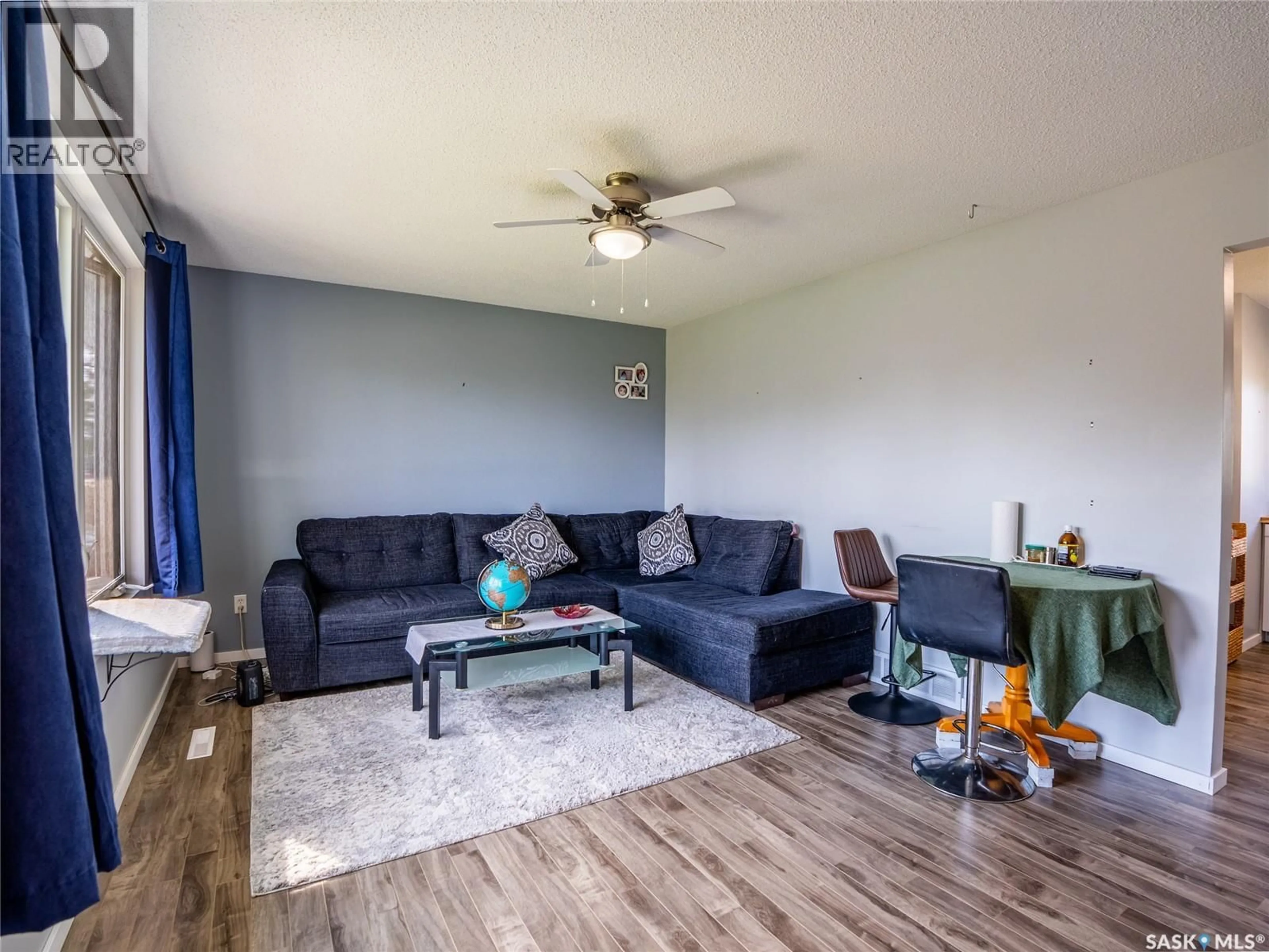 Living room with furniture, wood/laminate floor for 310 MAIN STREET, Abernethy Saskatchewan S0A0V0