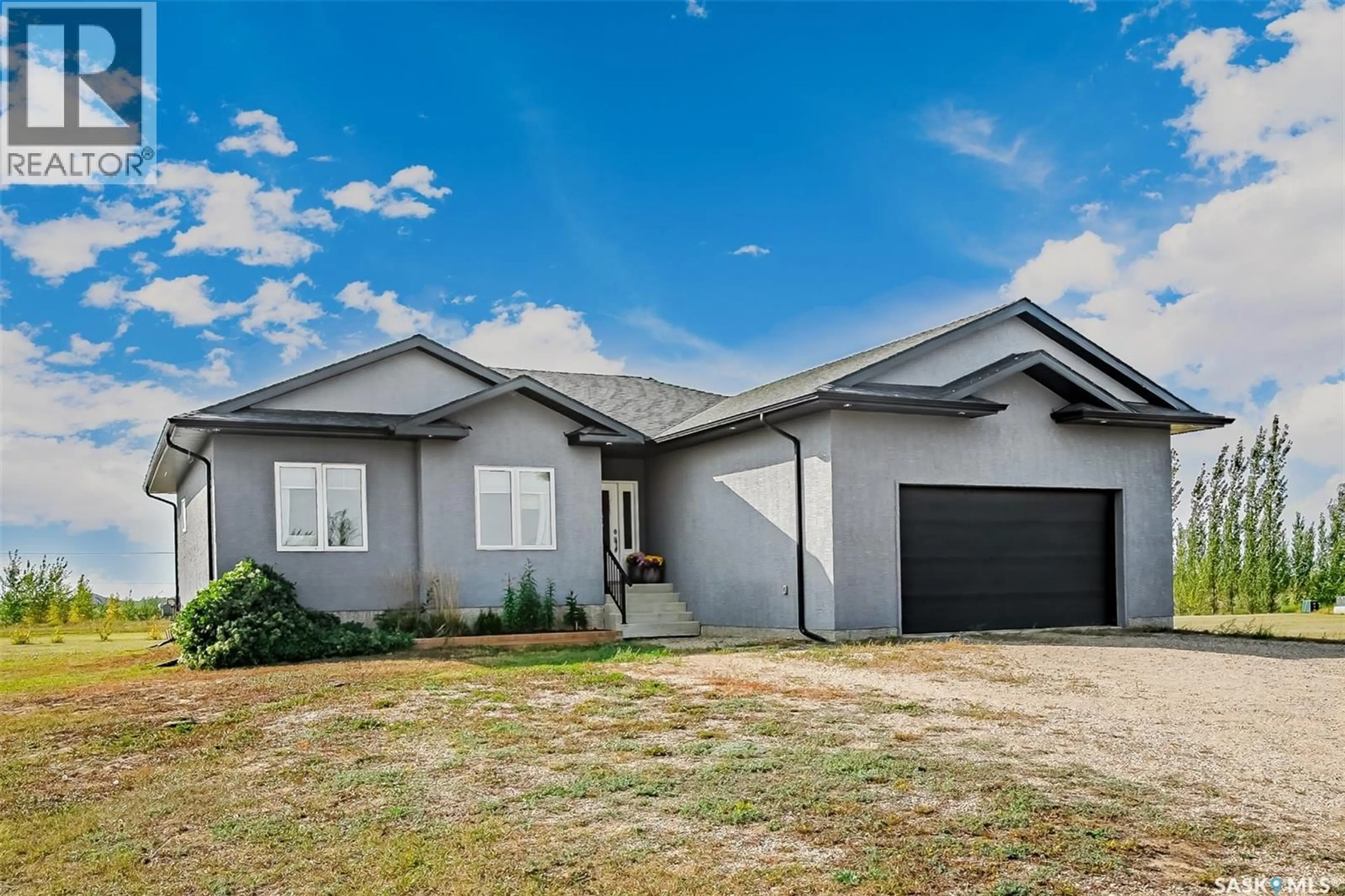 Home with vinyl exterior material, street for 25 SOUTH COUNTRY ROAD, Dundurn Rm No. 314 Saskatchewan S7C0B1