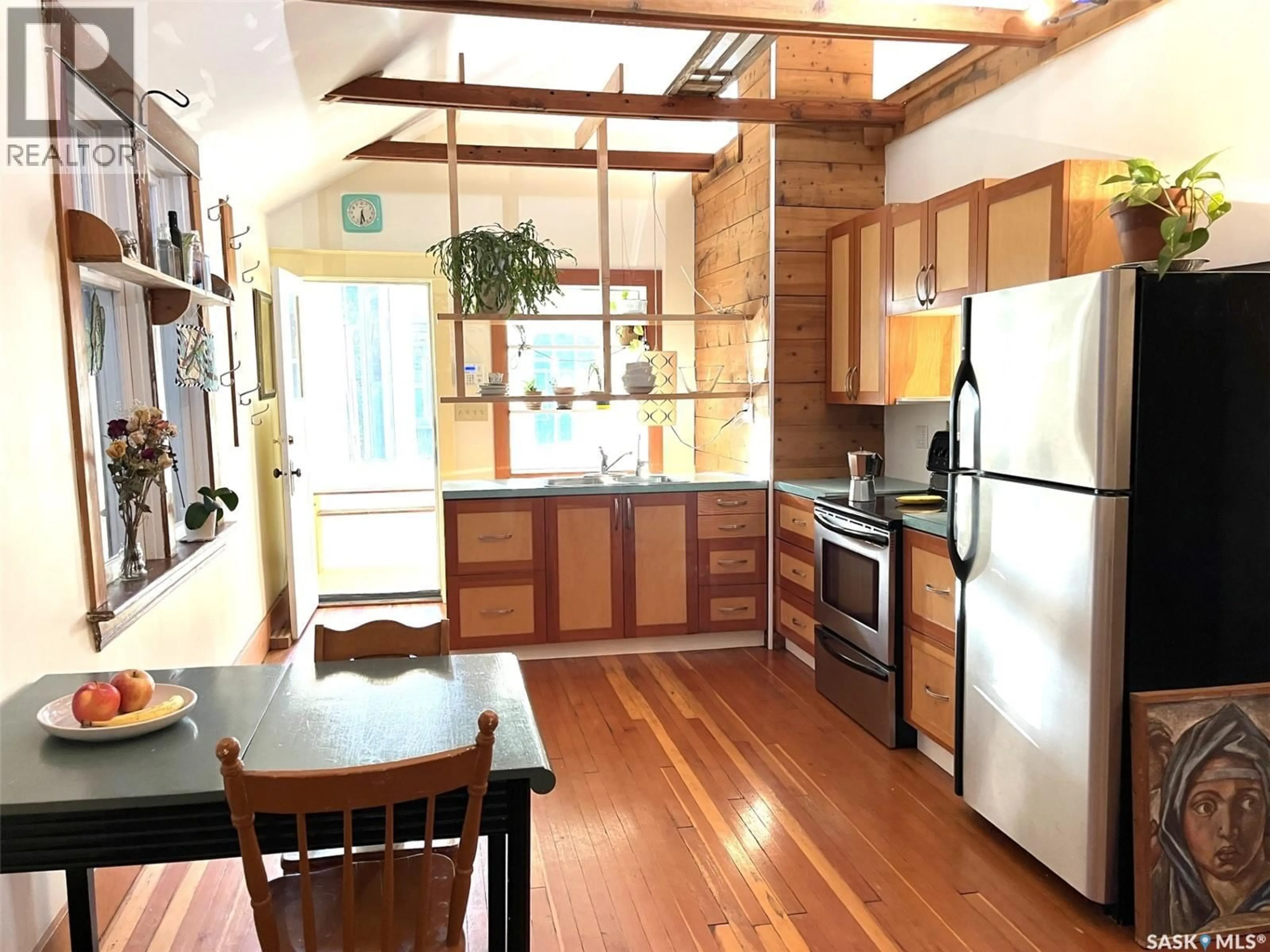 Open concept kitchen, wood/laminate floor for 1844 TORONTO STREET, Regina Saskatchewan S4P1M6