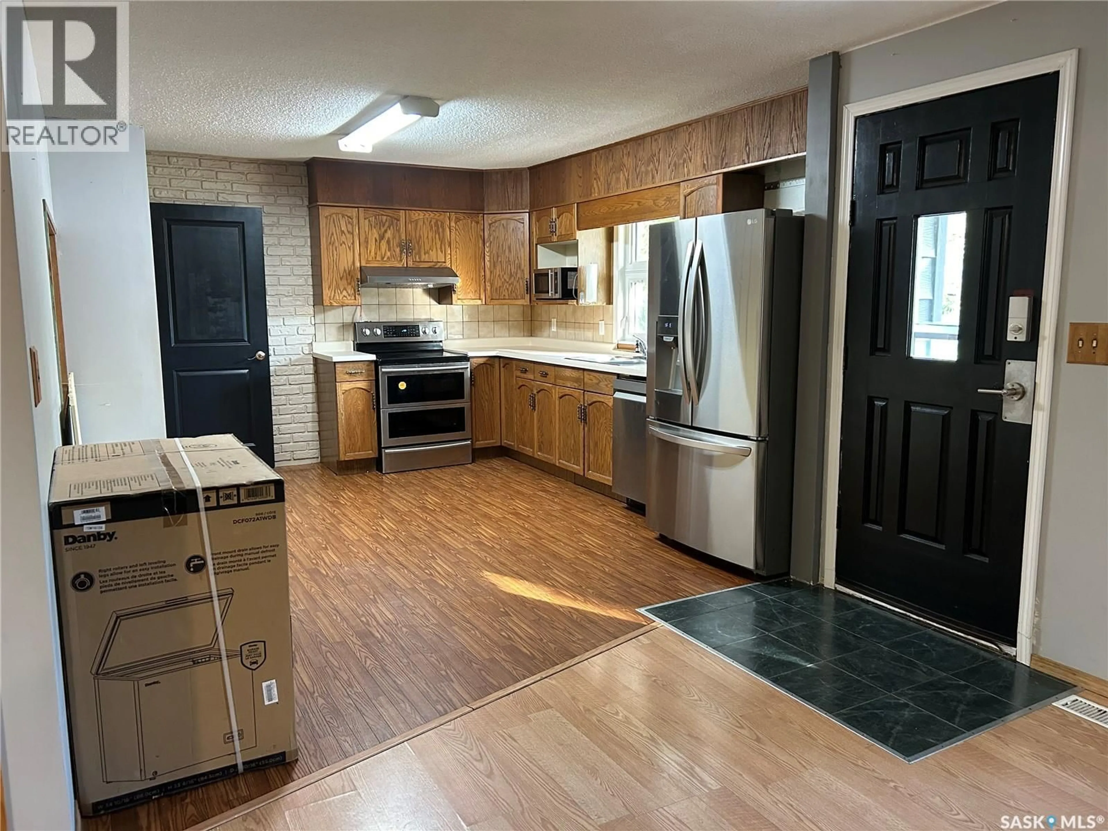 Open concept kitchen, unknown for 256 DUNCAN ROAD, Estevan Saskatchewan S4A0A4