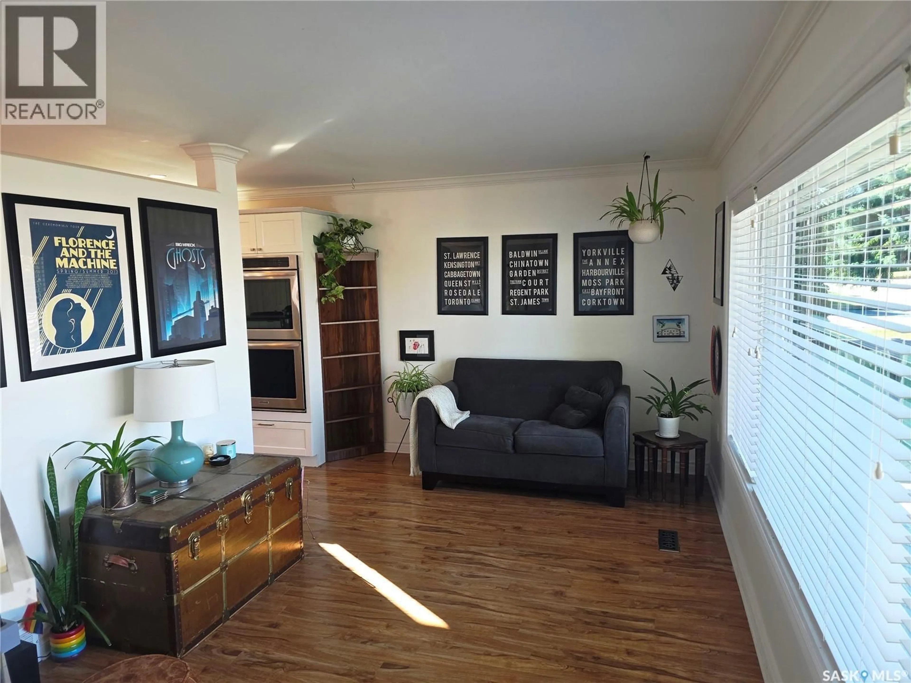 Living room with furniture, wood/laminate floor for 302 8TH STREET, Wynyard Saskatchewan S0A4T0