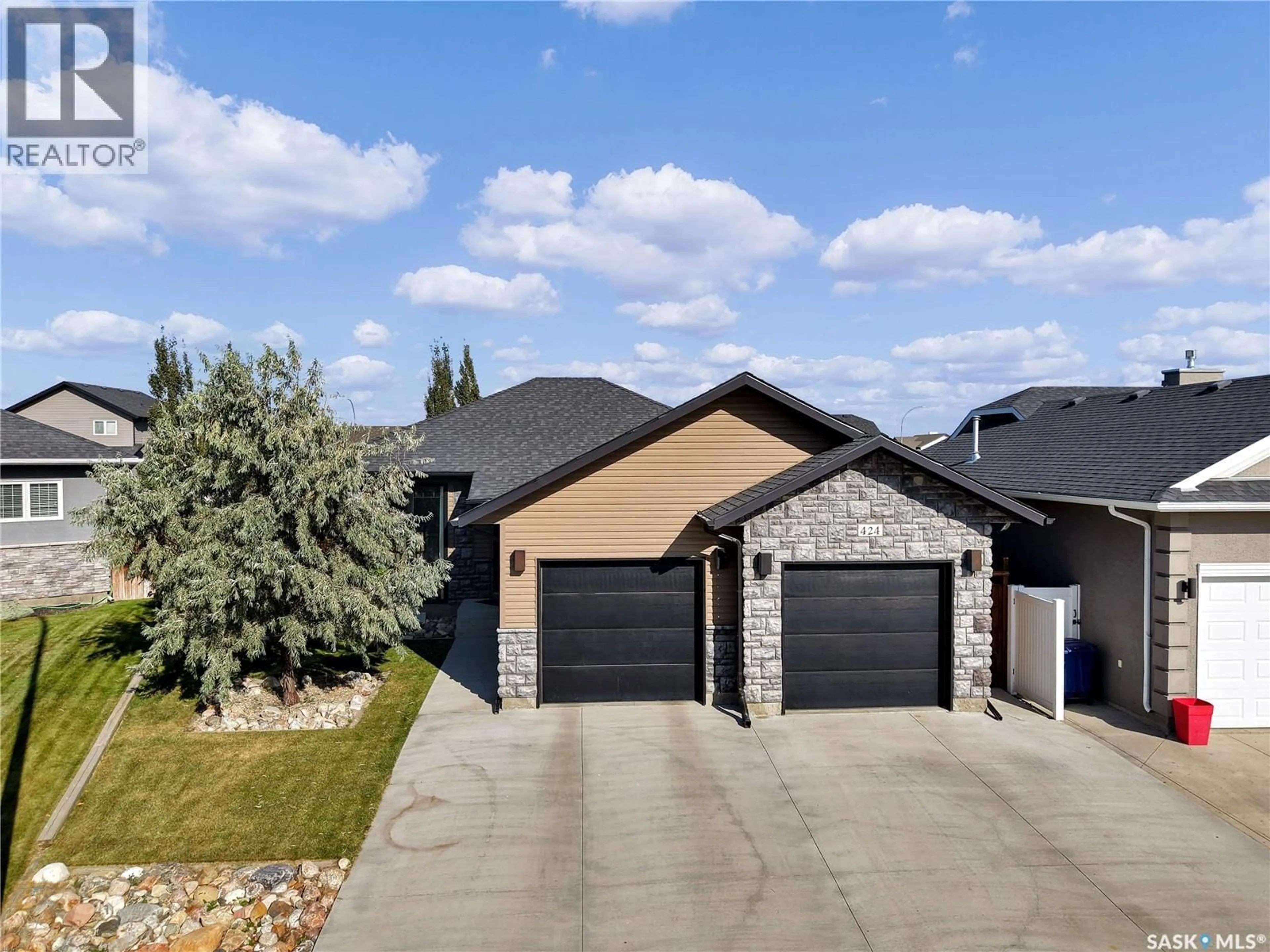Home with brick exterior material, street for 424 LYLE CRESCENT, Warman Saskatchewan S0K4S1