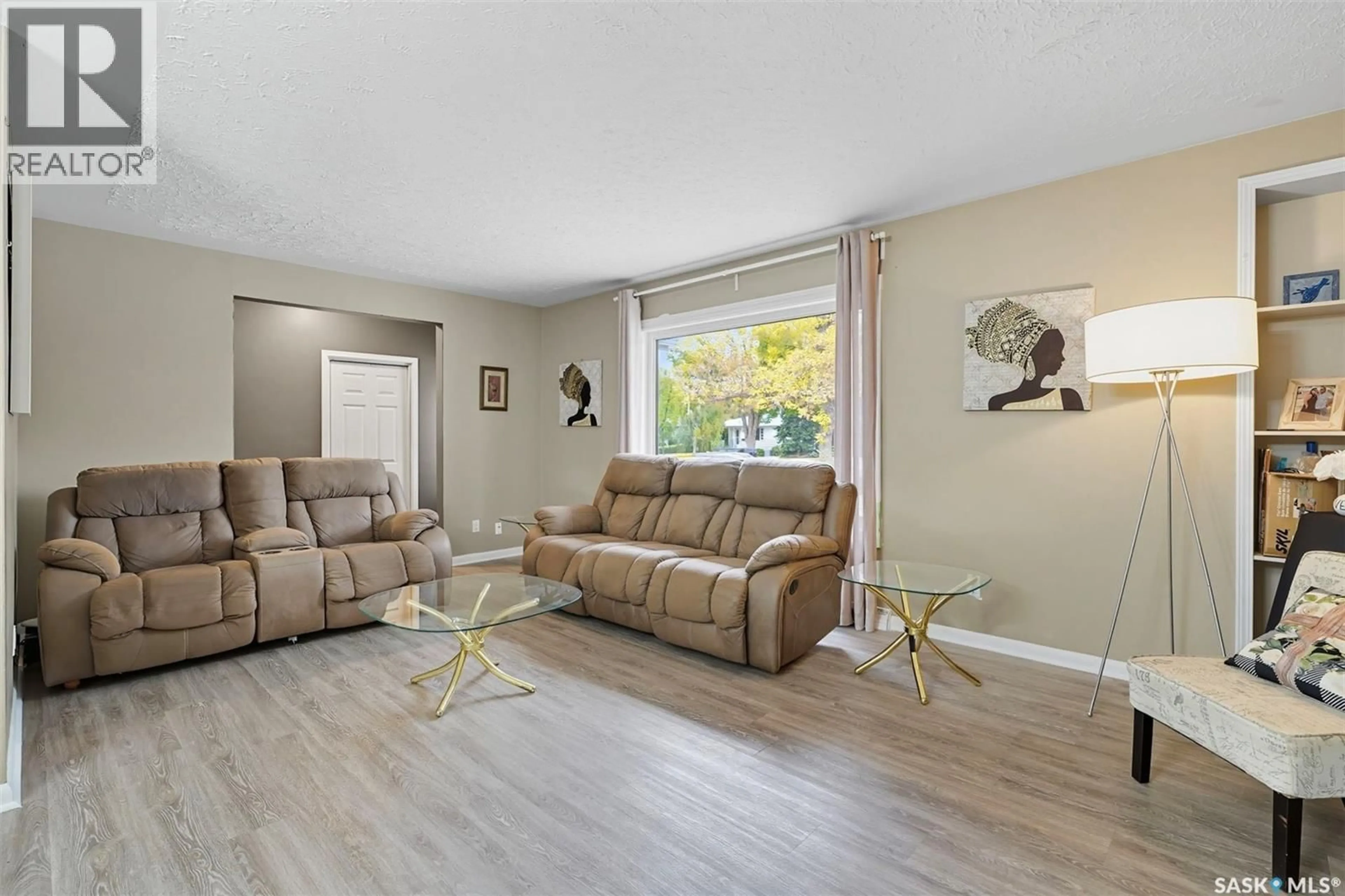Living room with furniture, wood/laminate floor for 2340 HAULTAIN AVENUE, Saskatoon Saskatchewan S7J1R1