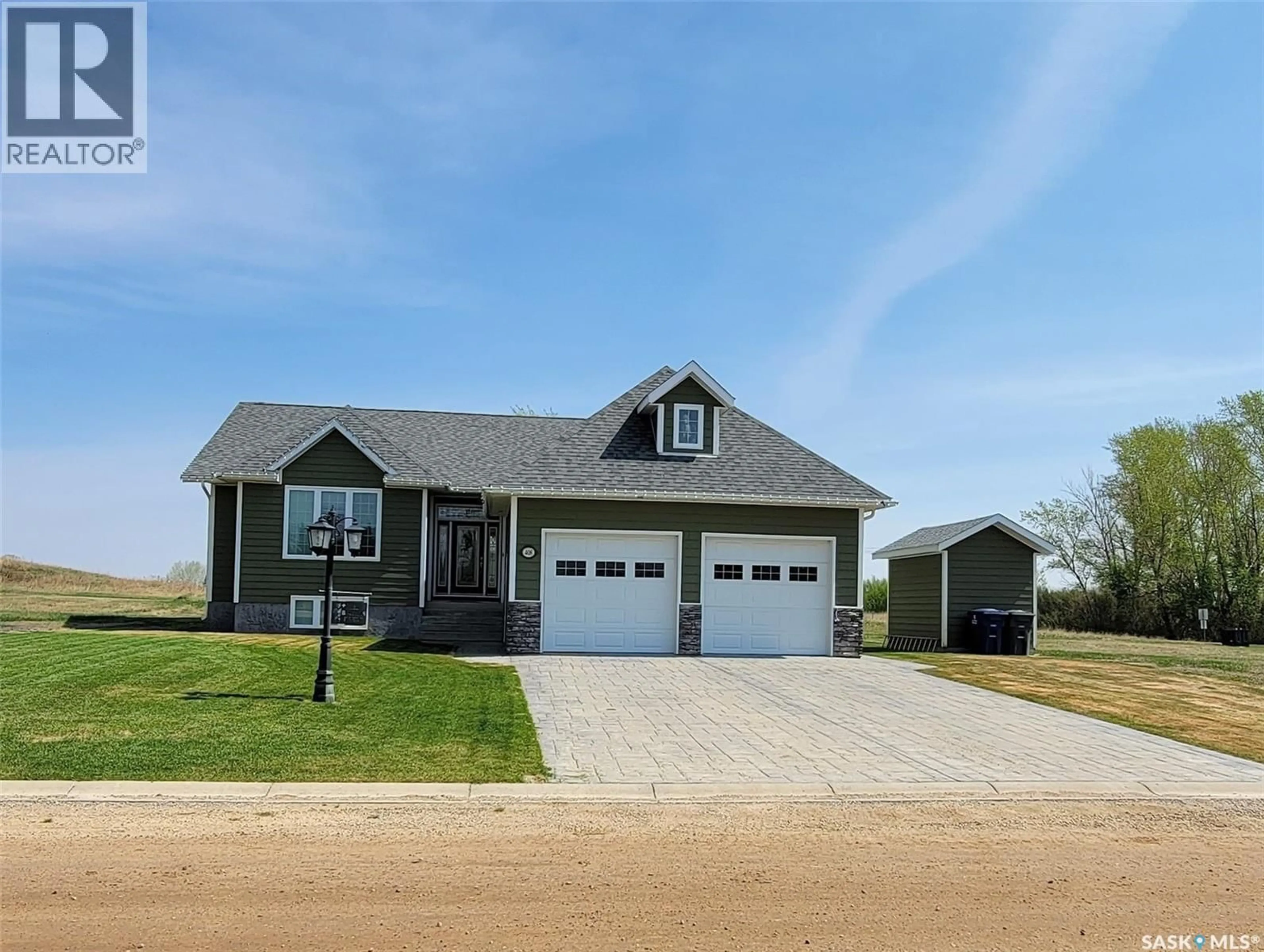 Home with vinyl exterior material, street for E - 408 5TH STREET, Wilkie Saskatchewan S0K4W0
