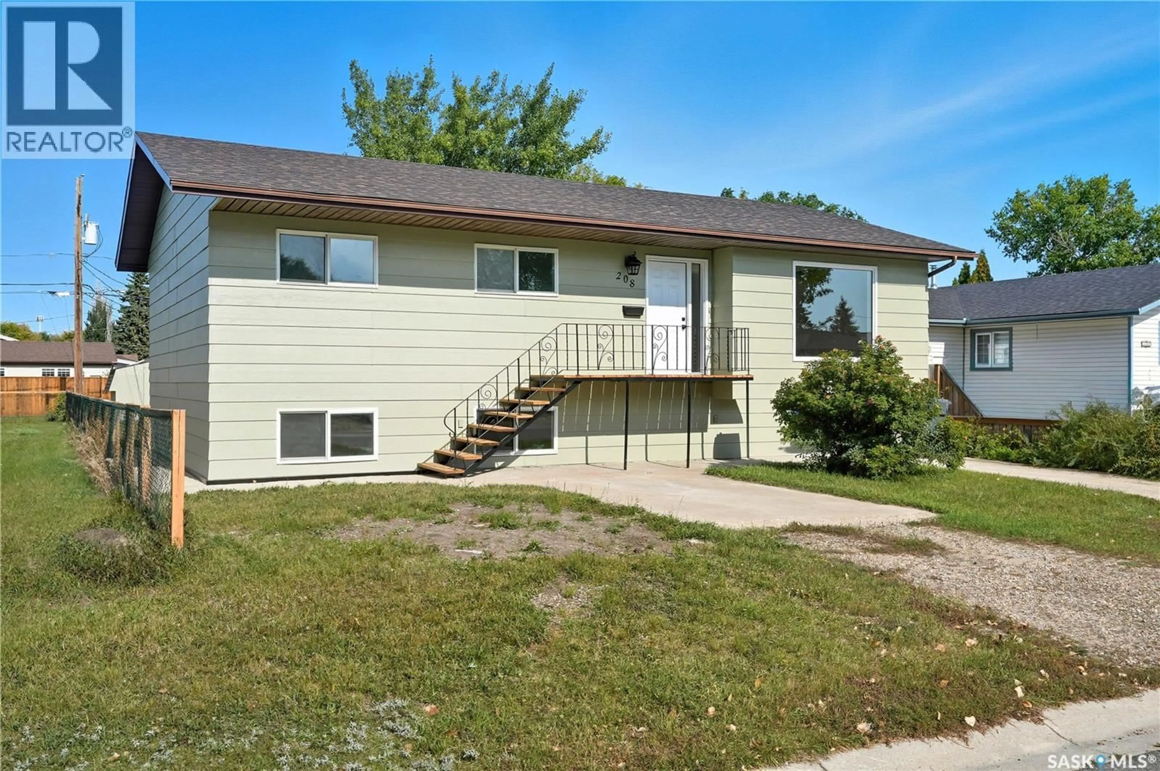 Home with vinyl exterior material, street for 208 RIGMOR STREET, Warman Saskatchewan S0K4S1