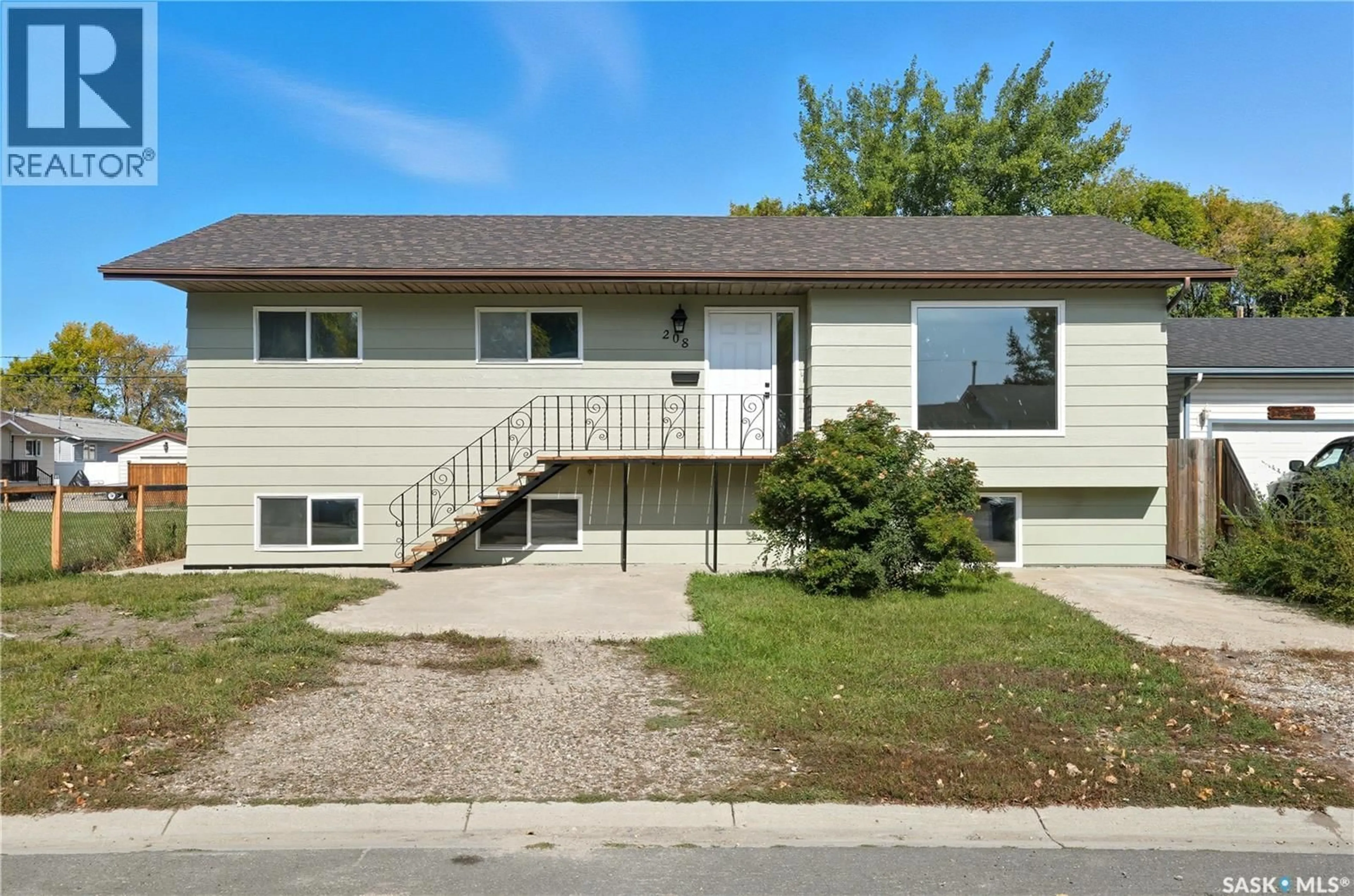 Home with vinyl exterior material, street for 208 RIGMOR STREET, Warman Saskatchewan S0K4S1