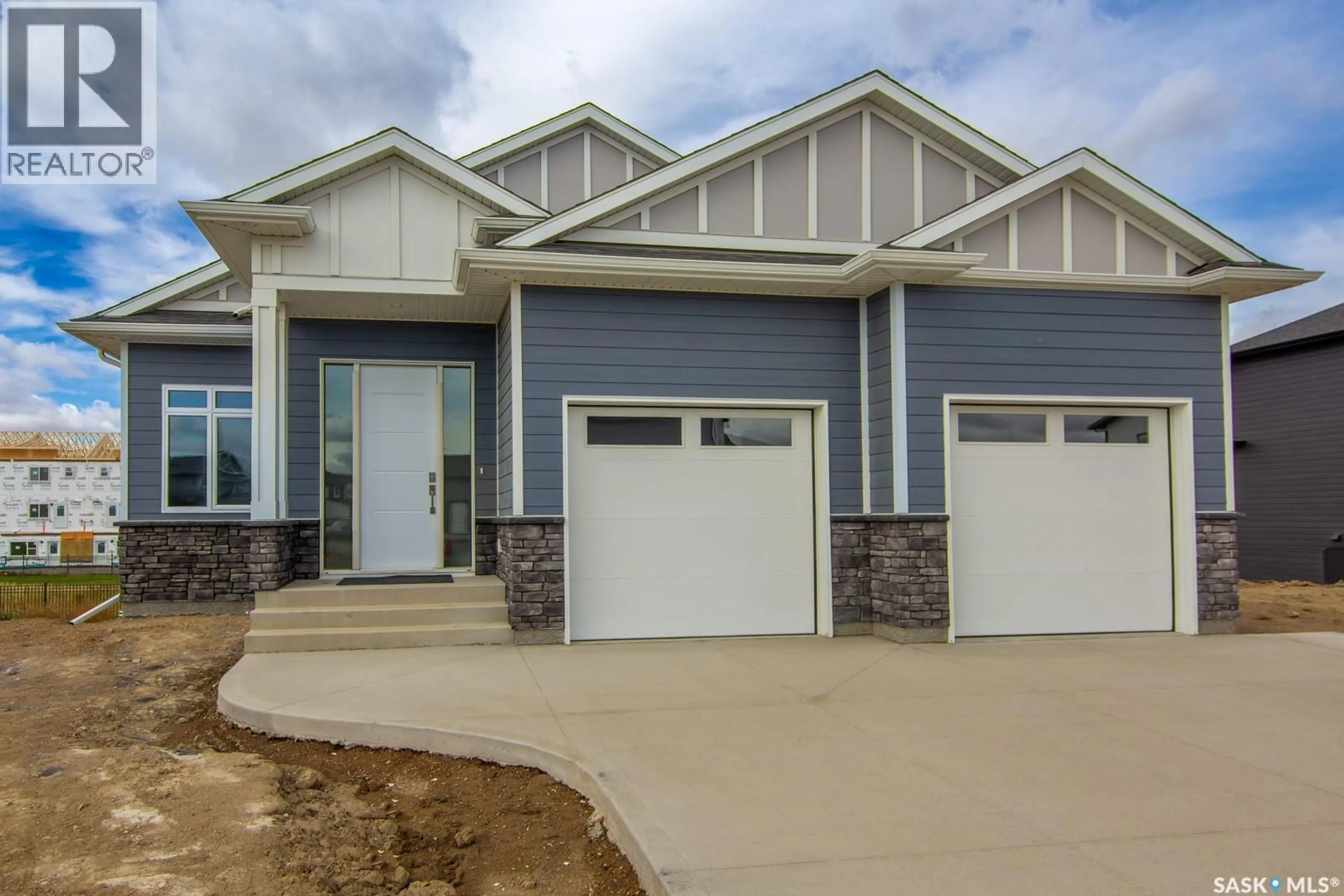 Home with vinyl exterior material, street for 423 SHARMA CRESCENT, Saskatoon Saskatchewan S7W1K7