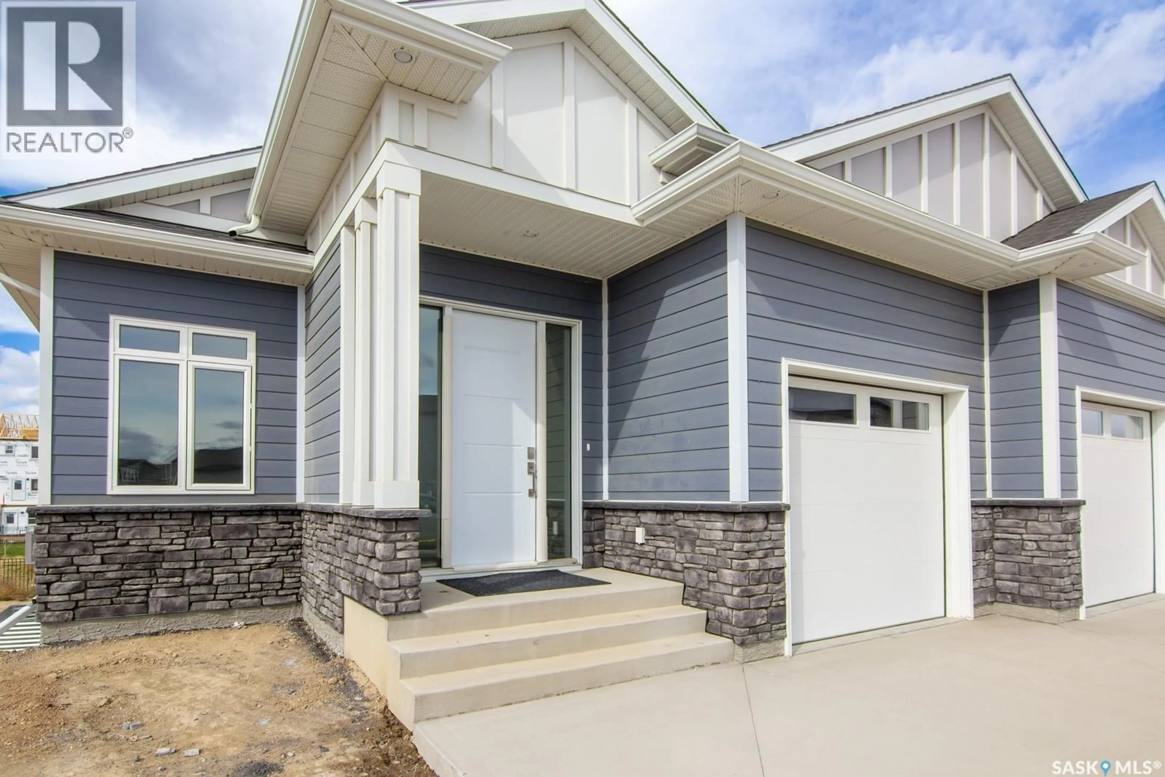 Home with vinyl exterior material, street for 423 SHARMA CRESCENT, Saskatoon Saskatchewan S7W1K7