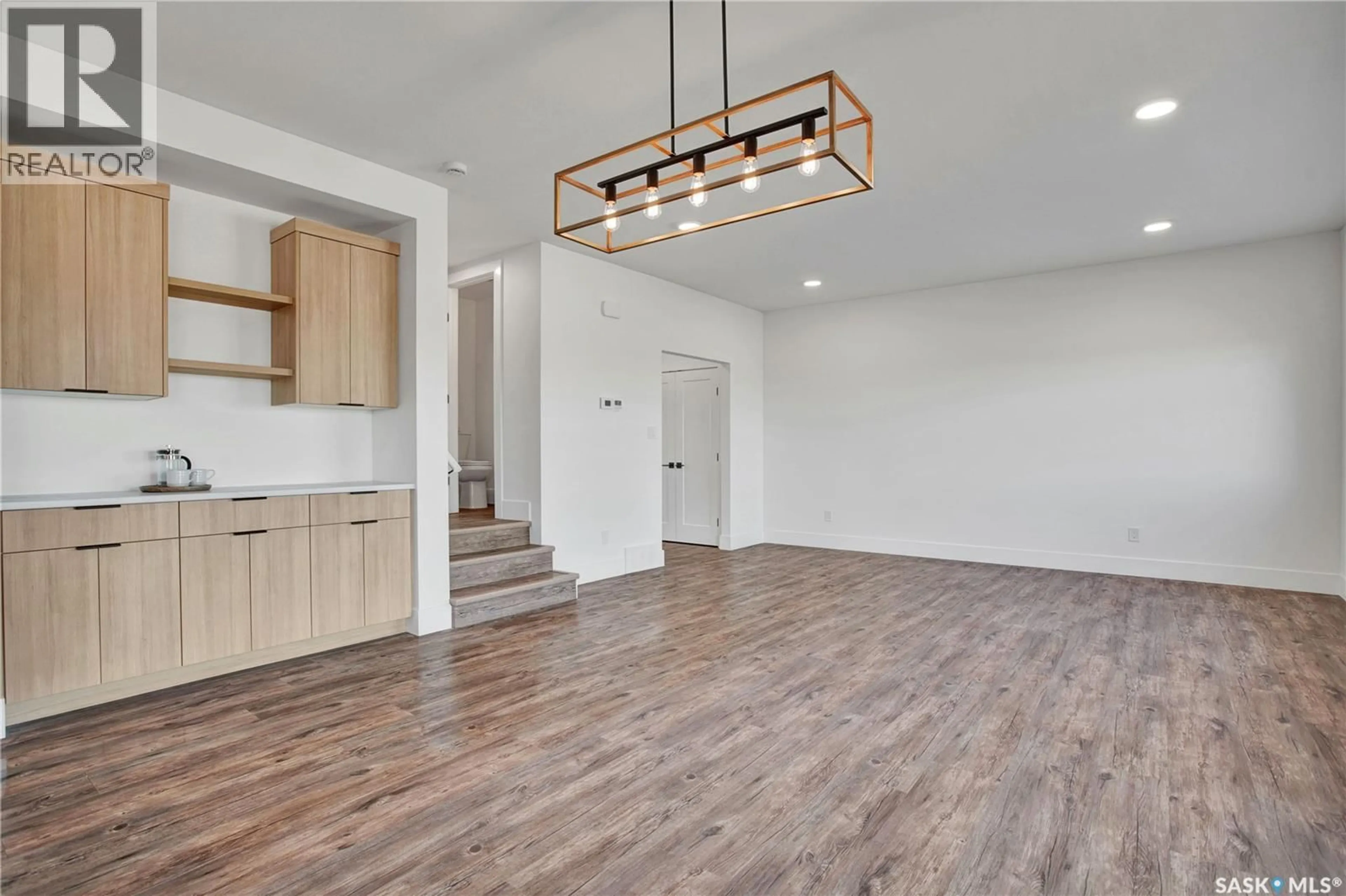 Open concept kitchen, wood/laminate floor for 109 EMMA CRESCENT, Martensville Saskatchewan S0K2T1