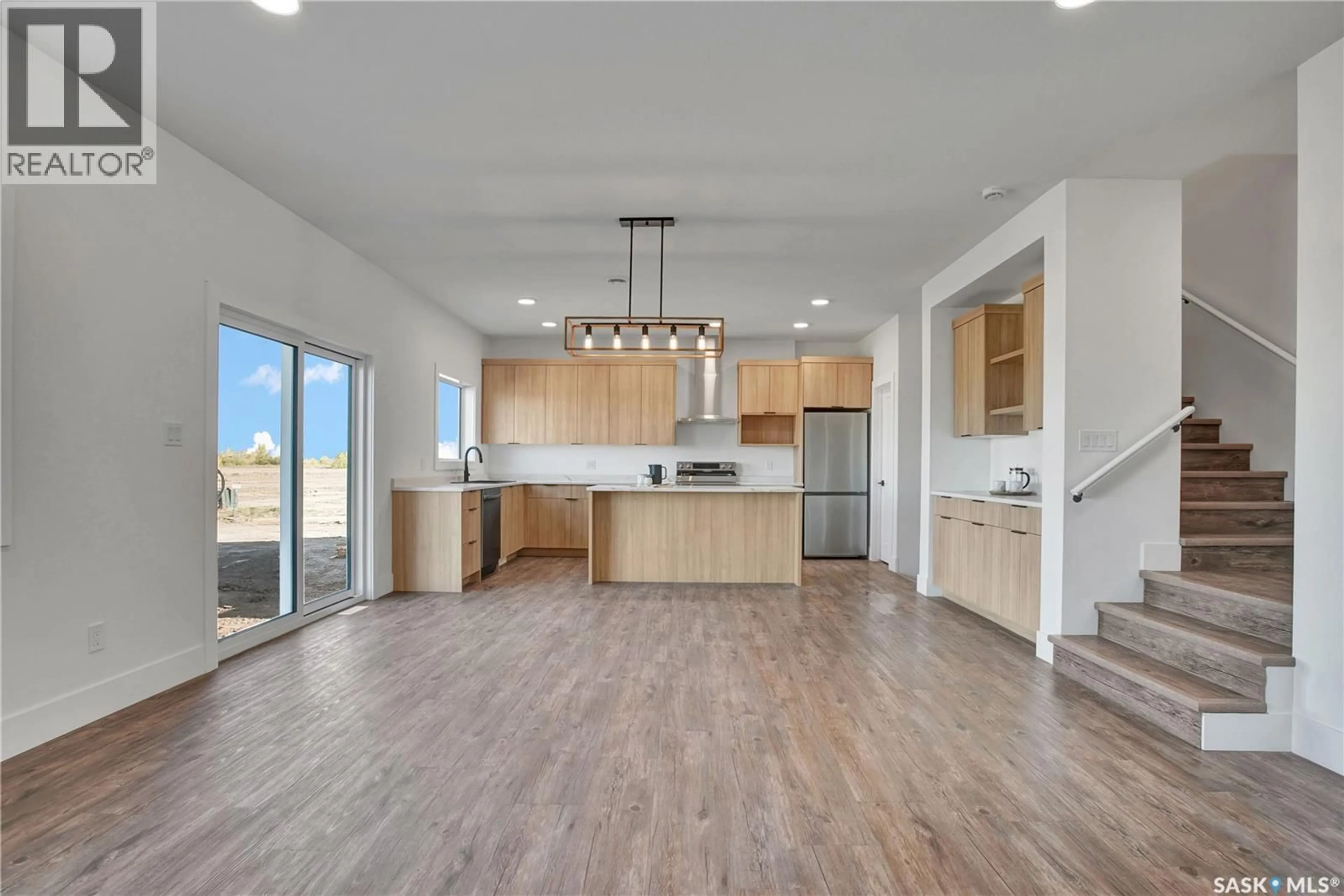 Open concept kitchen, wood/laminate floor for 109 EMMA CRESCENT, Martensville Saskatchewan S0K2T1