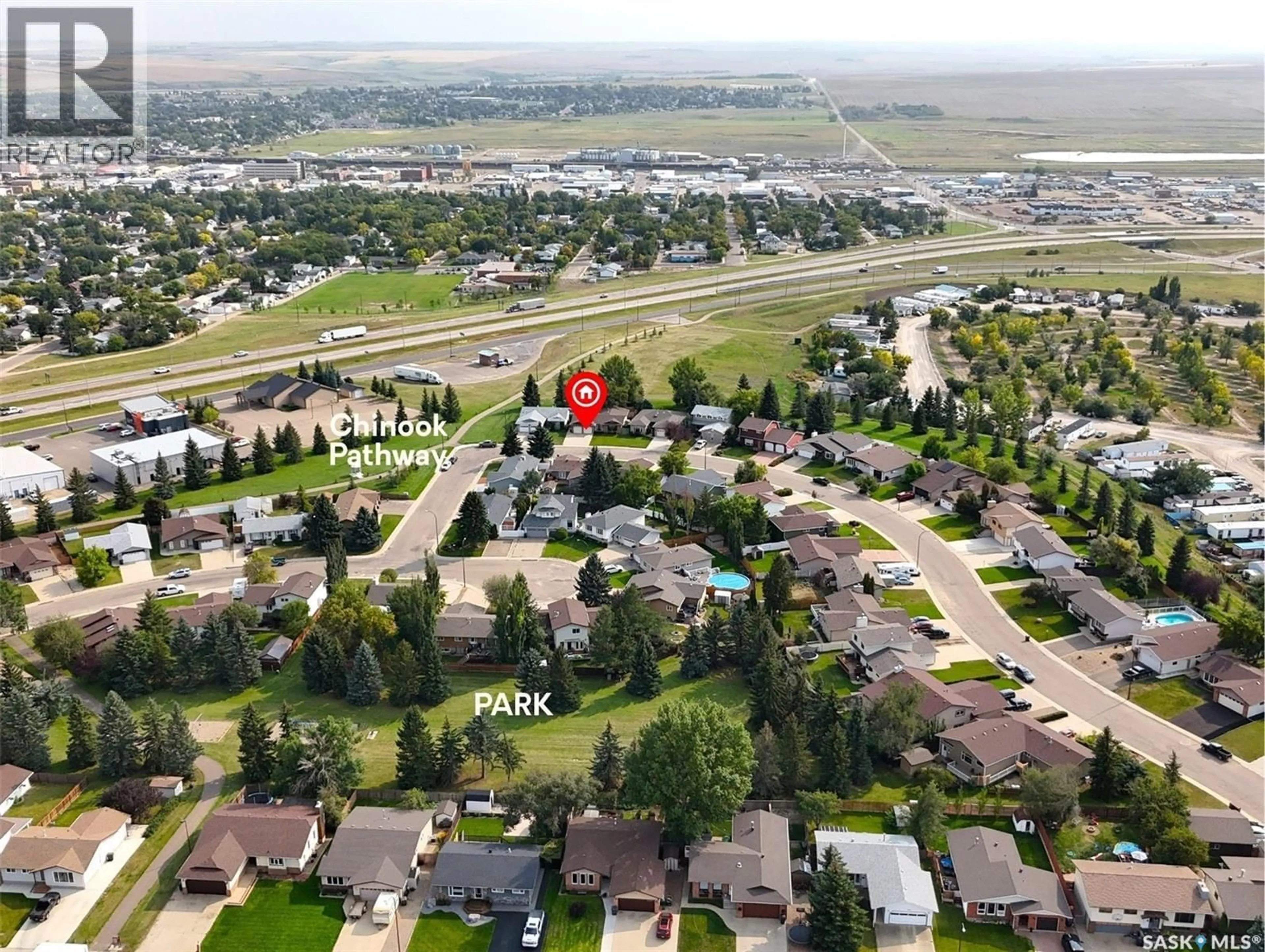 A pic from outside/outdoor area/front of a property/back of a property/a pic from drone, mountain view for 406 CURRY CRESCENT, Swift Current Saskatchewan S9H4X4