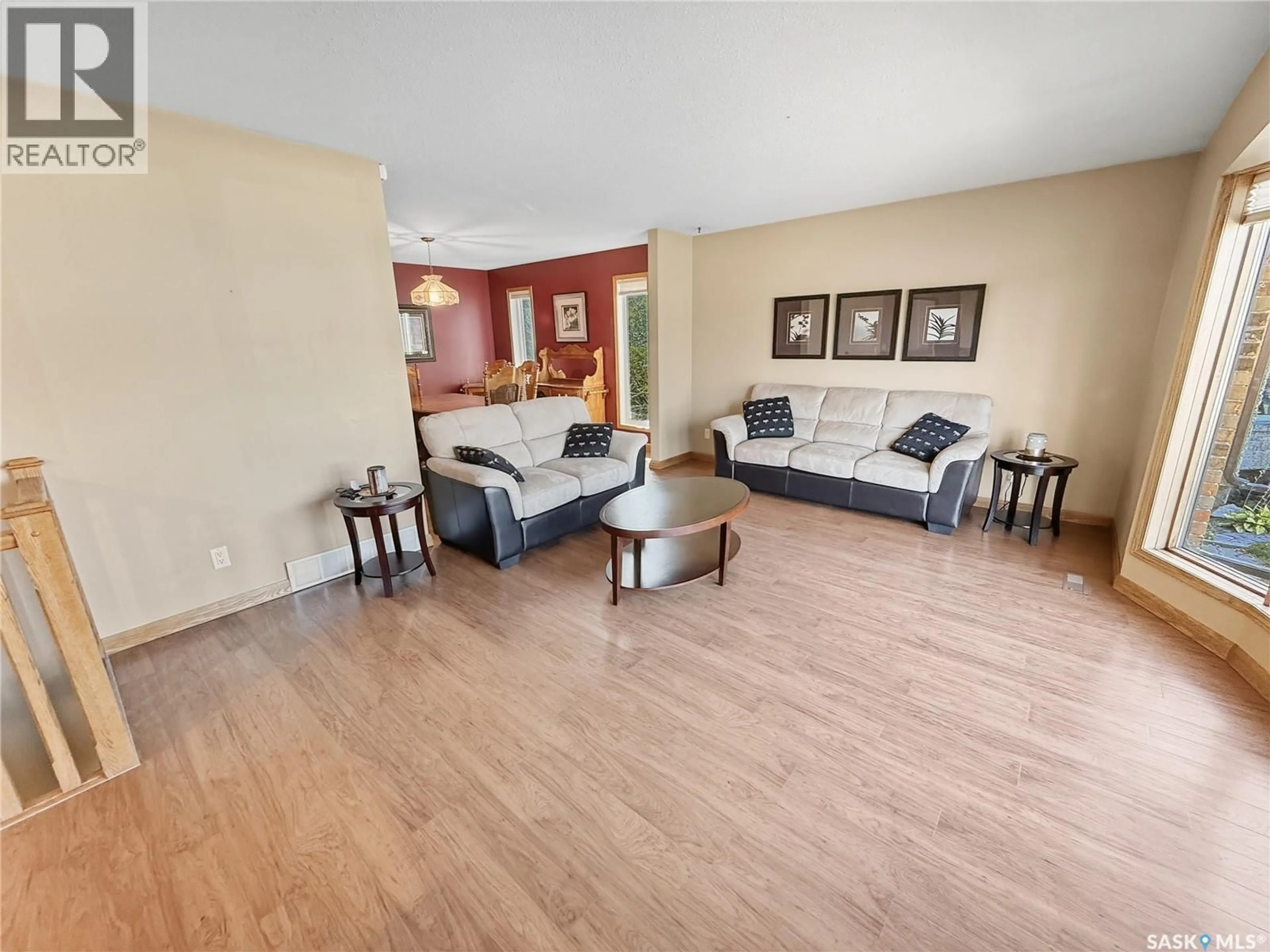 Living room with furniture, wood/laminate floor for 406 CURRY CRESCENT, Swift Current Saskatchewan S9H4X4