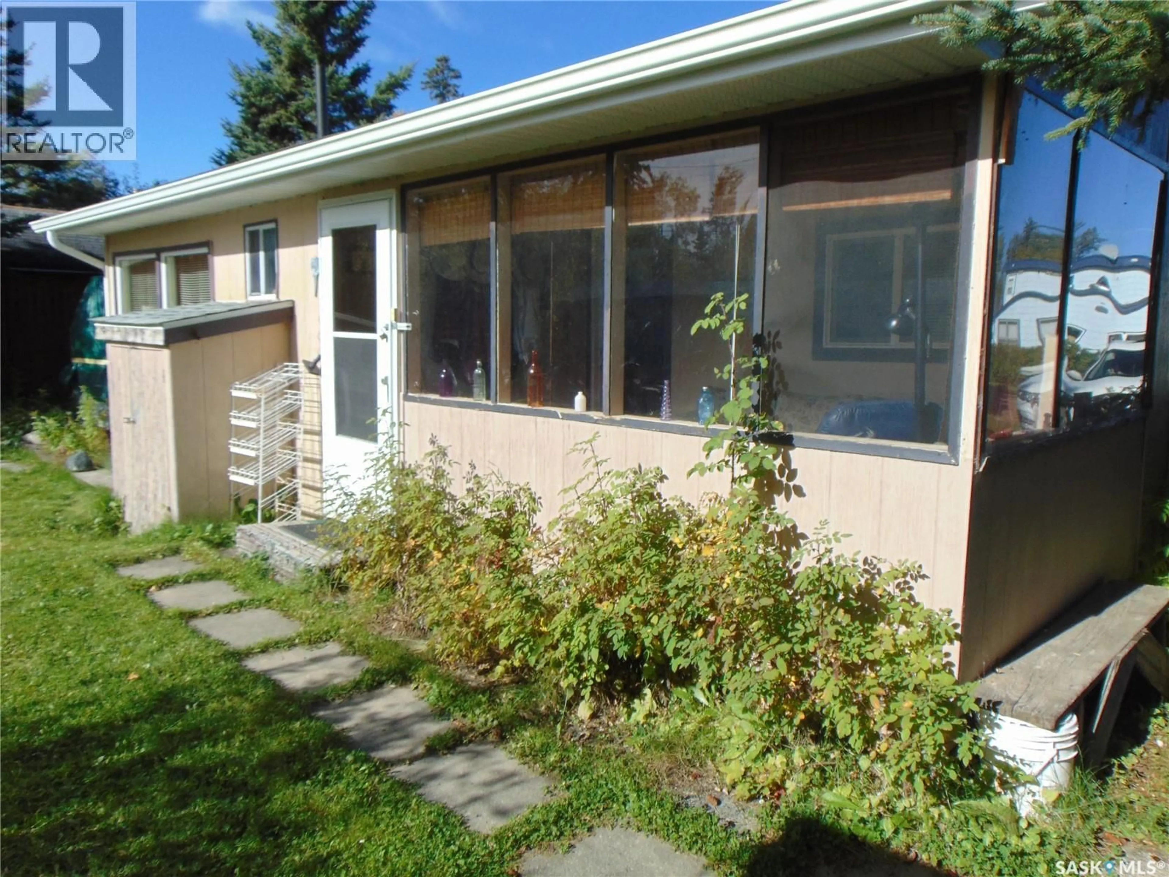 Home with vinyl exterior material, street for 113 FOSTER STREET, Lakeland Rm No. 521 Saskatchewan S0J0N0
