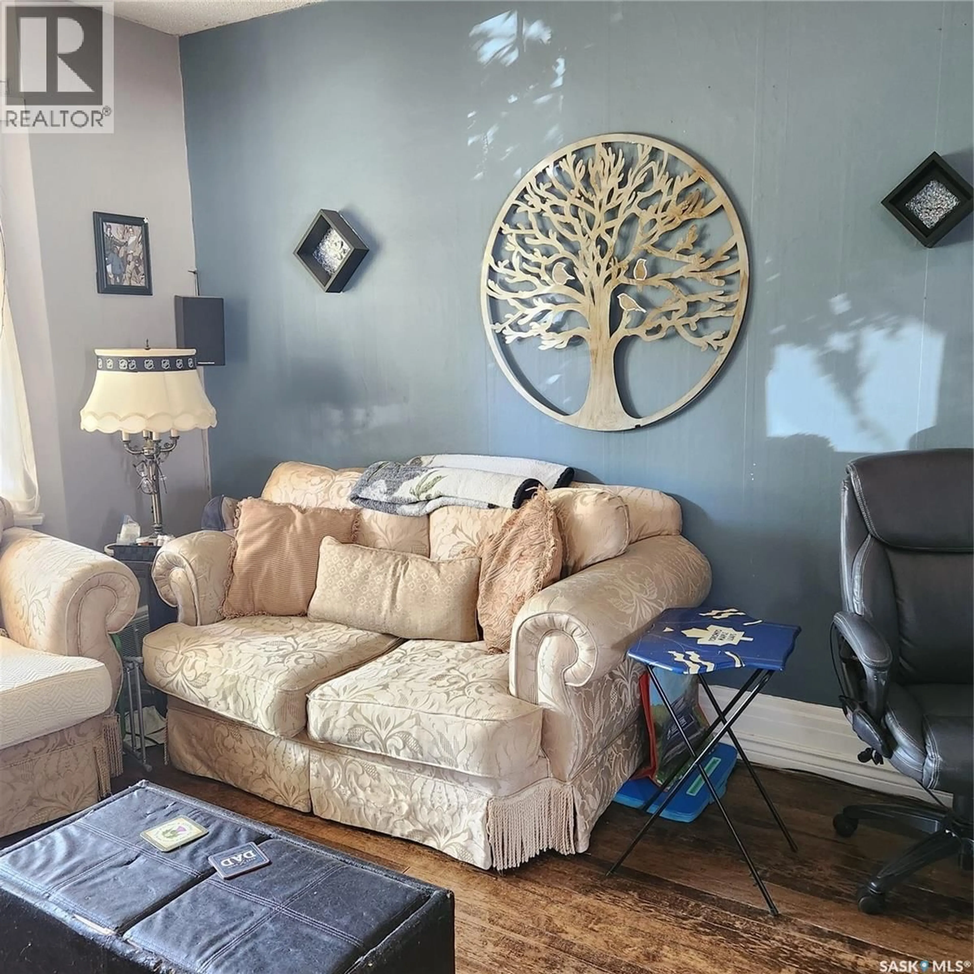 Living room with furniture, wood/laminate floor for 358-364 STADACONA STREET, Moose Jaw Saskatchewan S6H1Z6