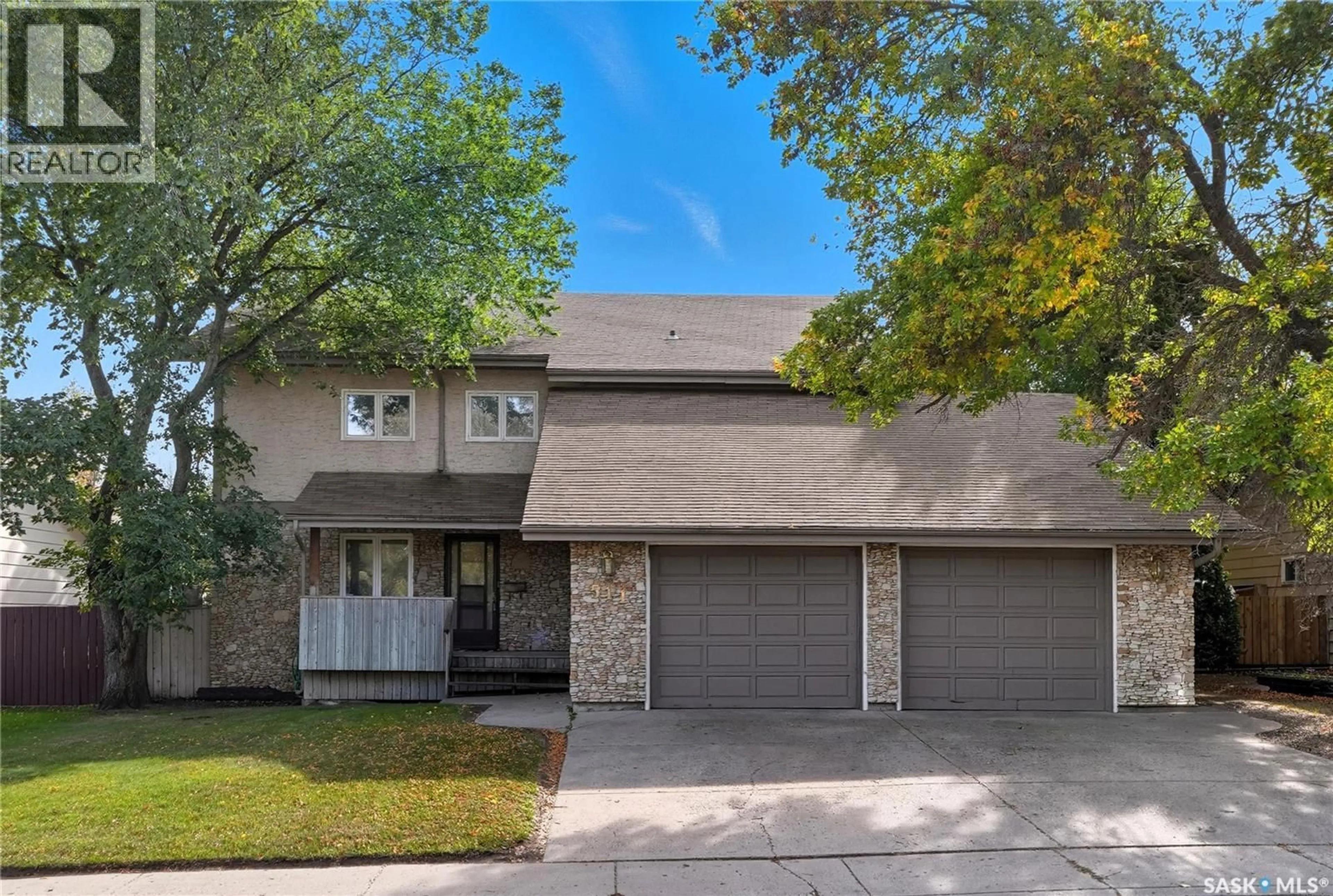 Home with vinyl exterior material, street for 511 AE ADAMS CRESCENT, Saskatoon Saskatchewan S7K5N1