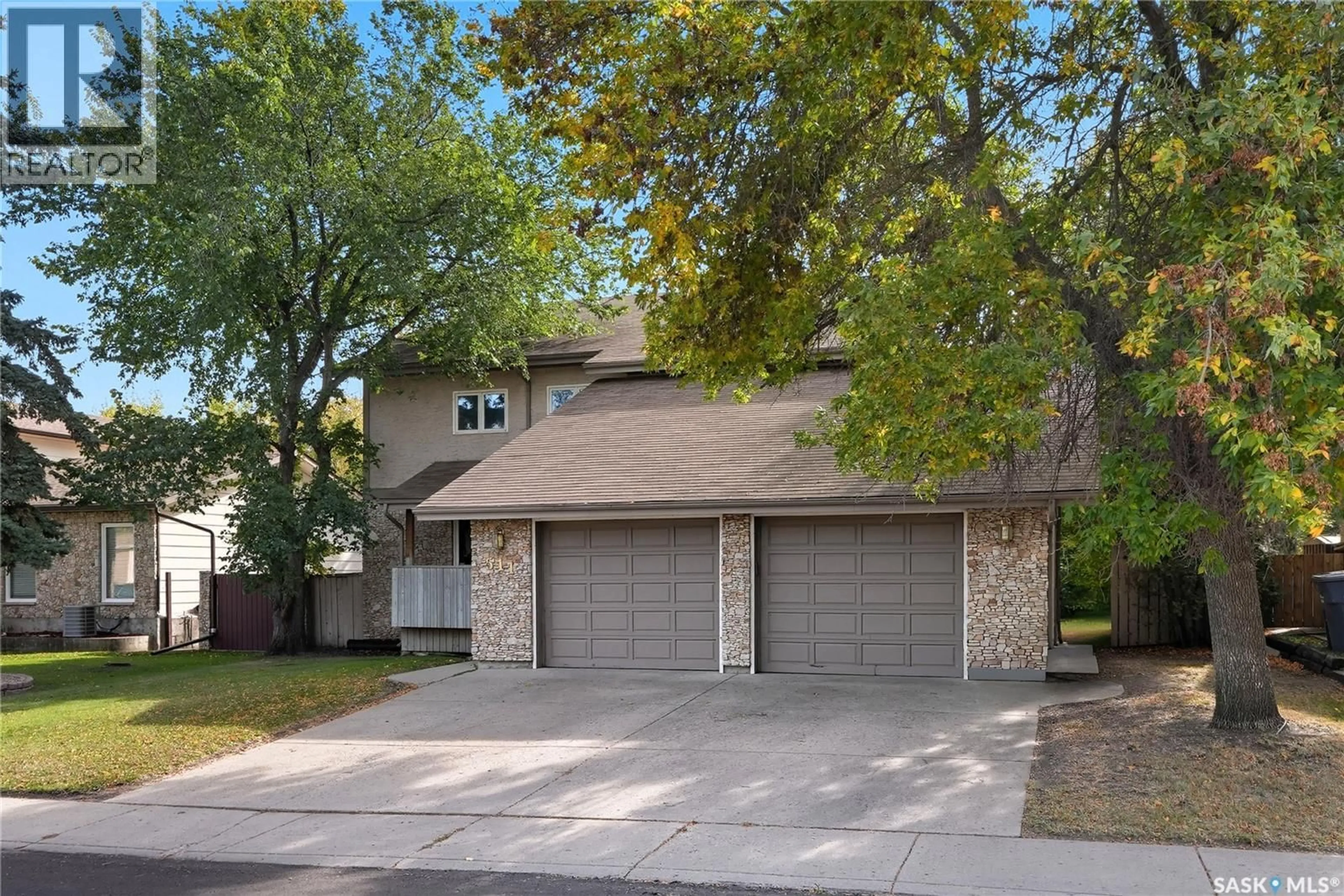 Home with vinyl exterior material, street for 511 AE ADAMS CRESCENT, Saskatoon Saskatchewan S7K5N1