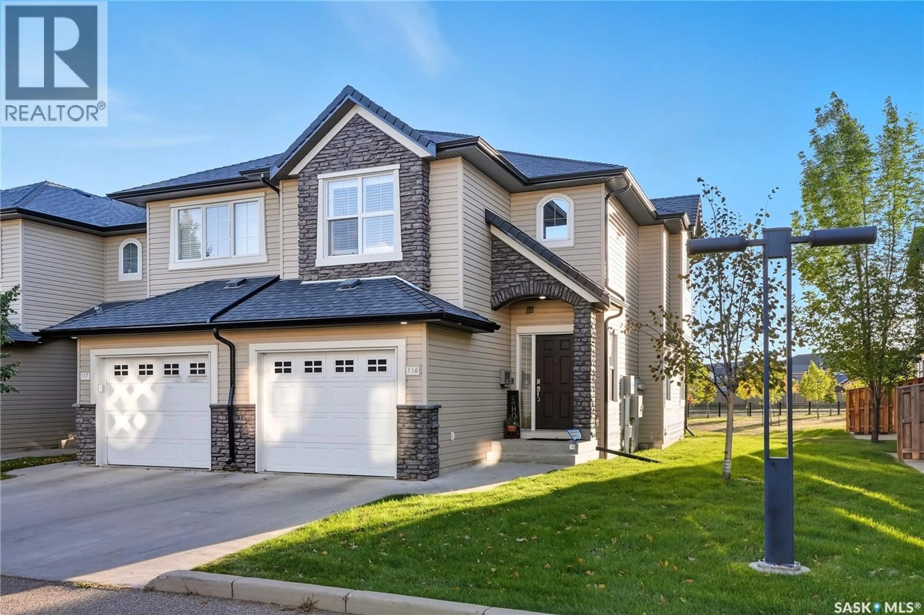 Home with vinyl exterior material, street for 410 - 116 LEDINGHAM WAY, Saskatoon Saskatchewan S7V0C4
