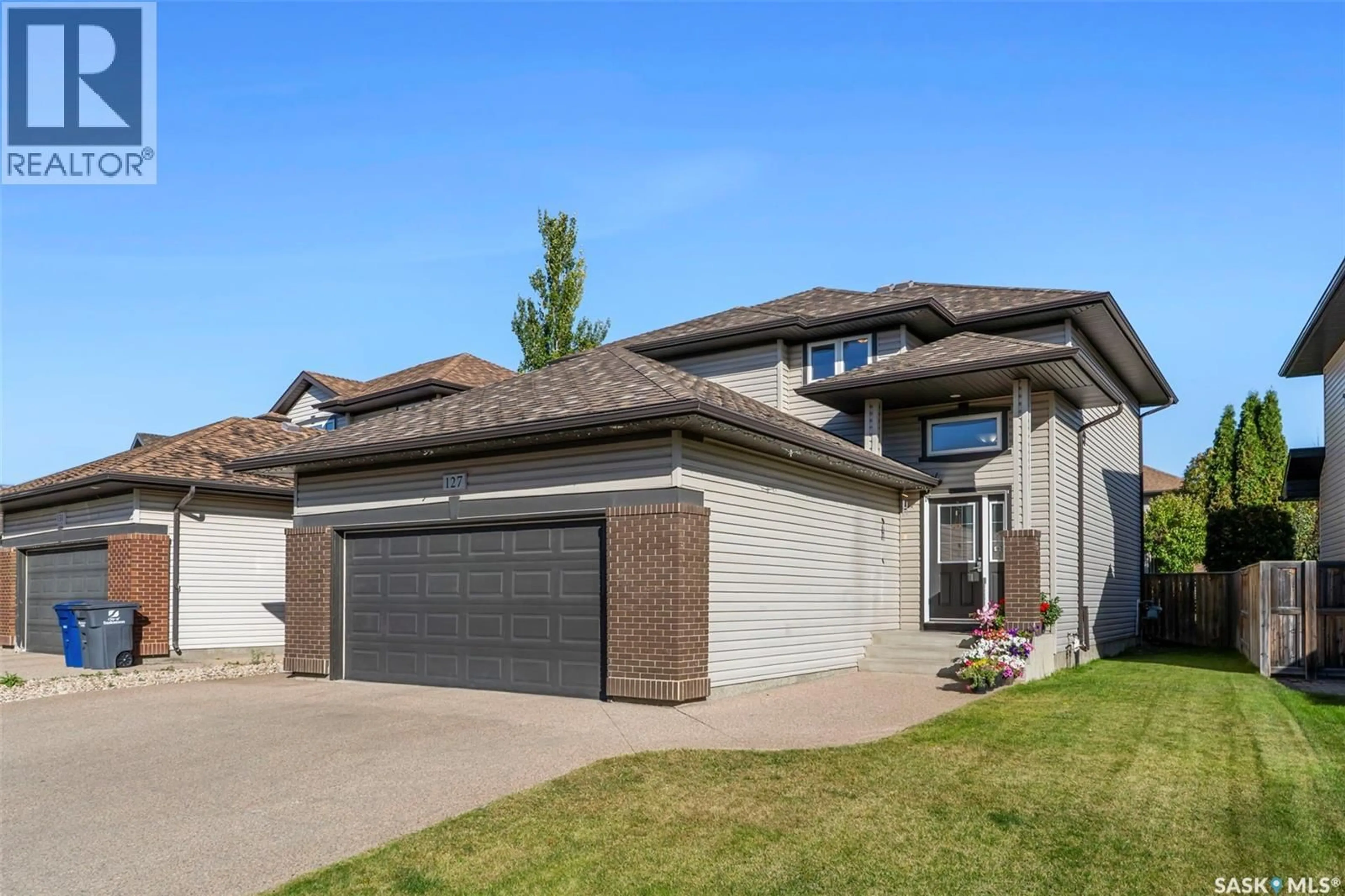 Home with brick exterior material, street for 127 DULMAGE CRESCENT, Saskatoon Saskatchewan S7T0C7