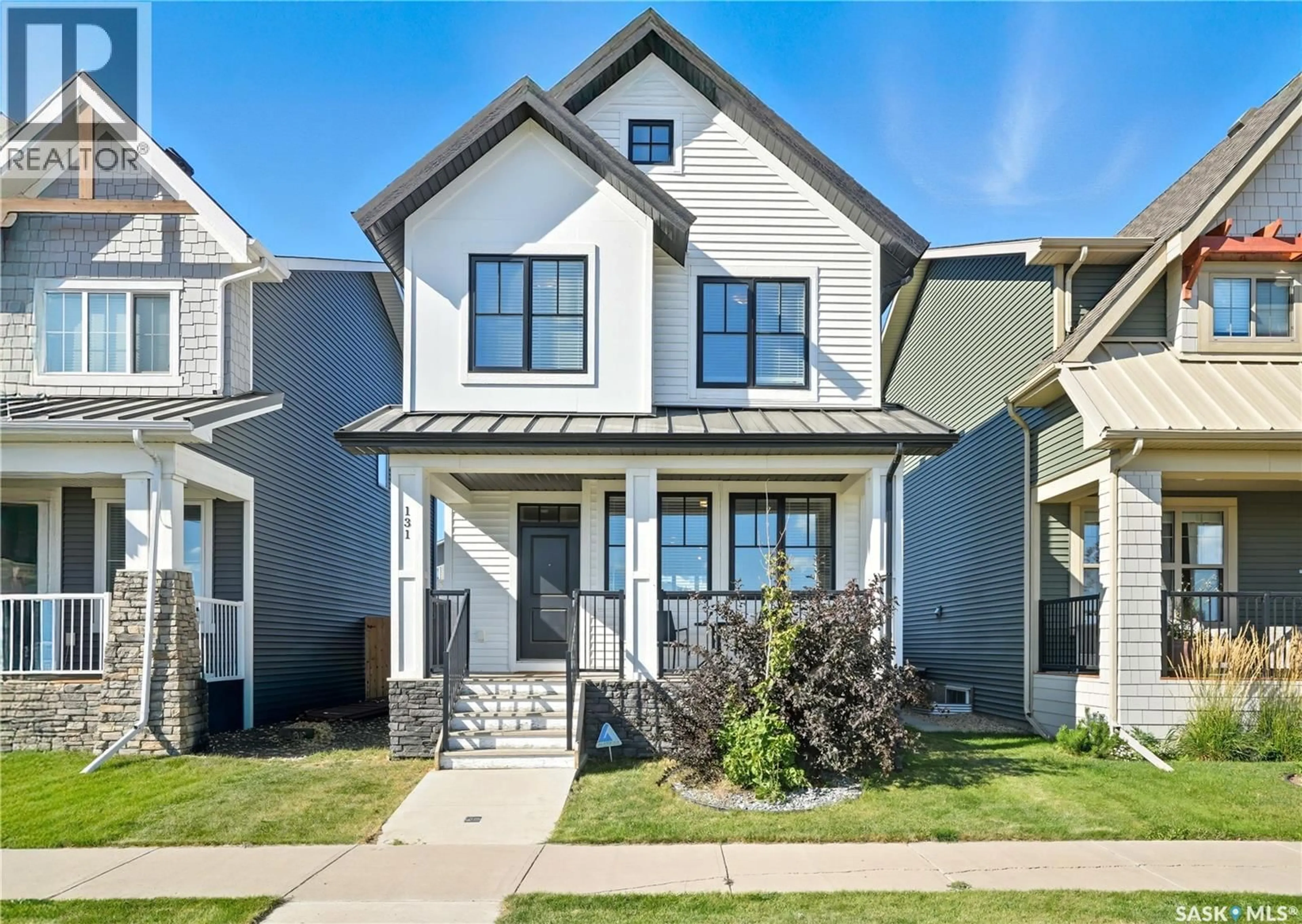 Home with vinyl exterior material, street for 131 SKOPIK ROAD, Saskatoon Saskatchewan S7V0V7