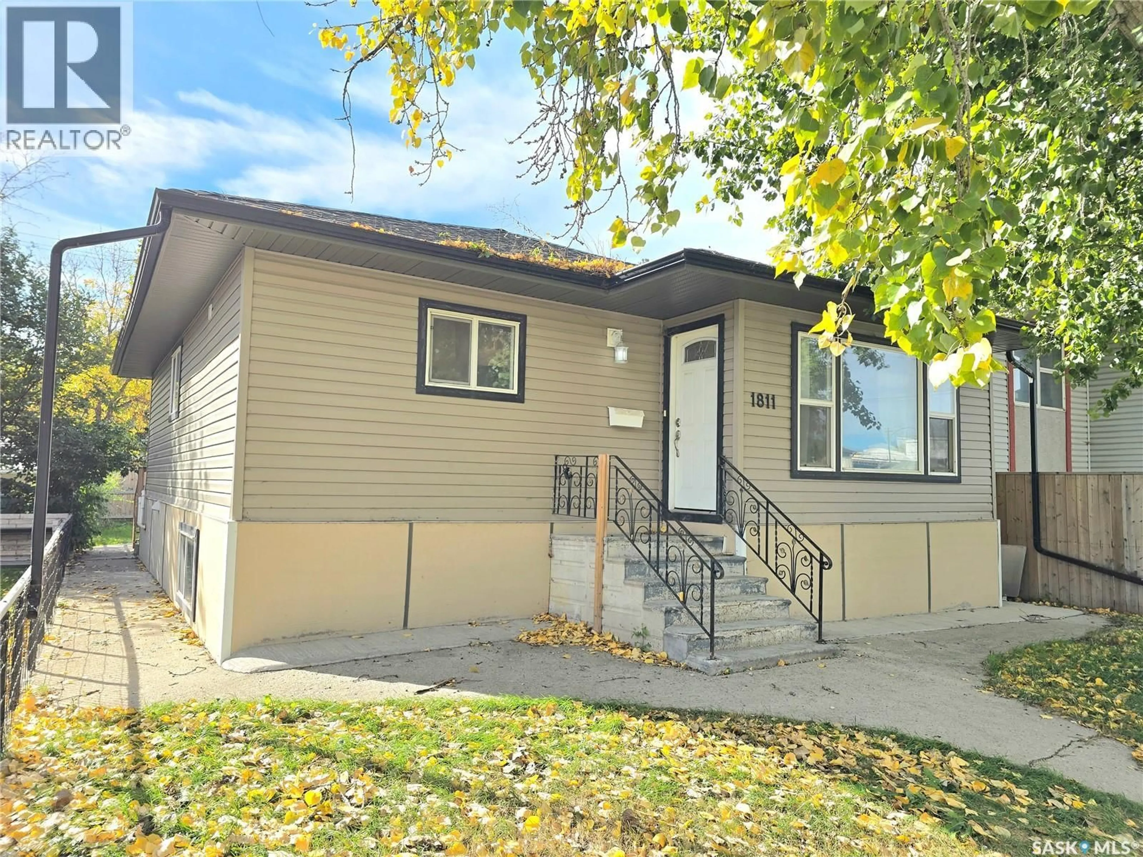Home with vinyl exterior material, street for 1811 20TH STREET, Saskatoon Saskatchewan S7M1A1