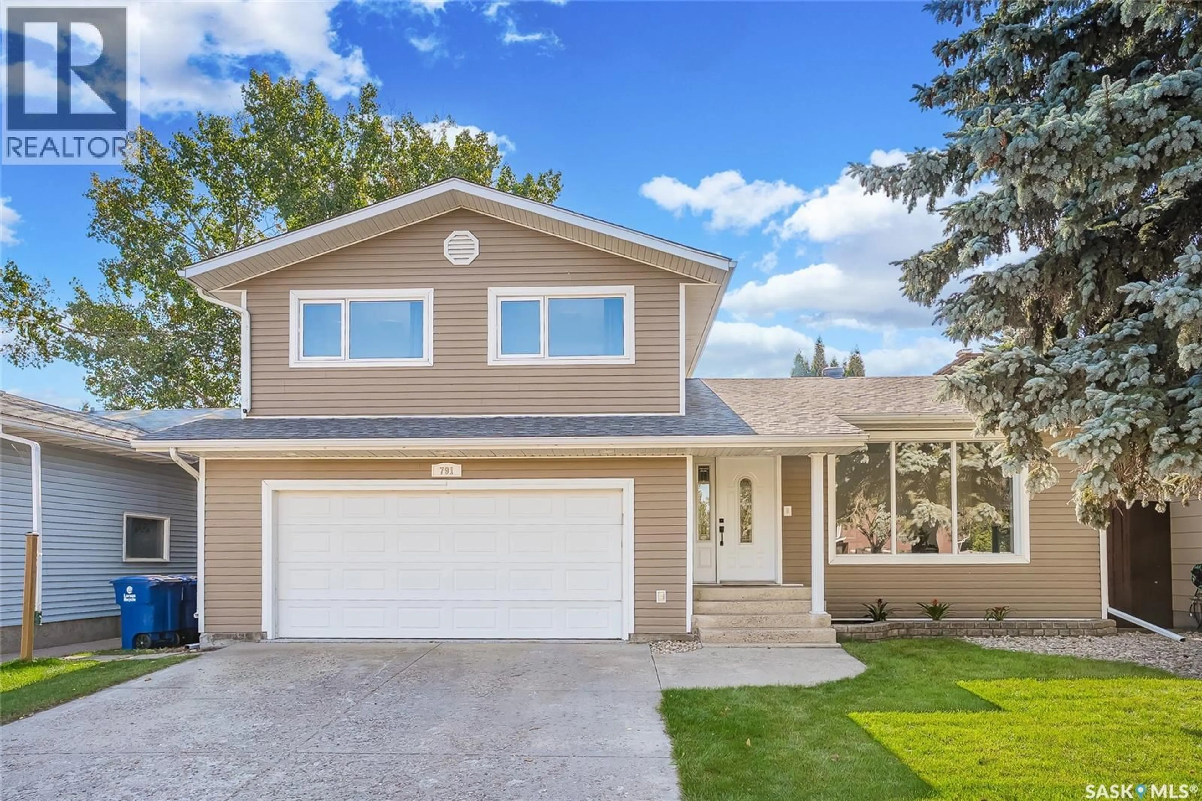 Home with vinyl exterior material, street for 791 LENORE DRIVE, Saskatoon Saskatchewan S7K5G9