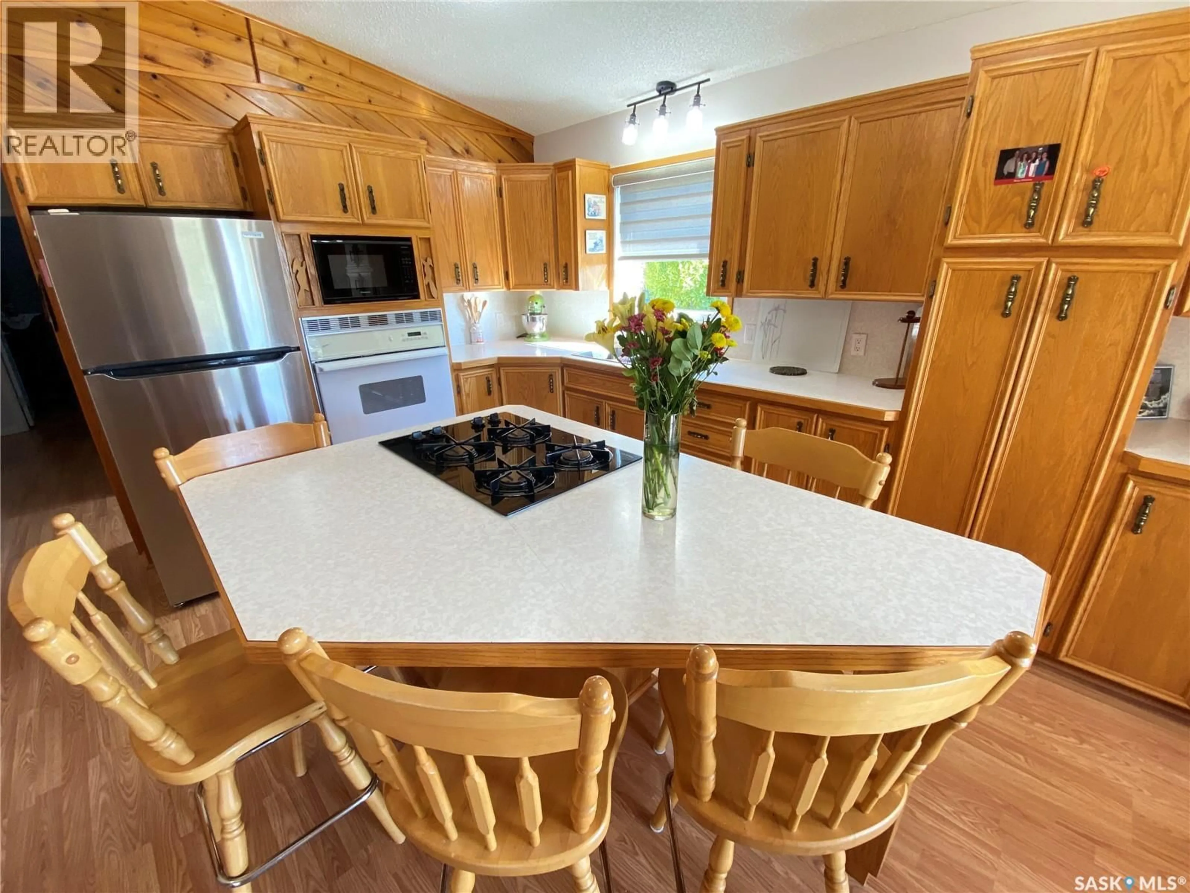 Open concept kitchen, wood/laminate floor for 139 PEBBLE BEACH ROAD, Good Lake Rm No. 274 Saskatchewan S0A0L0
