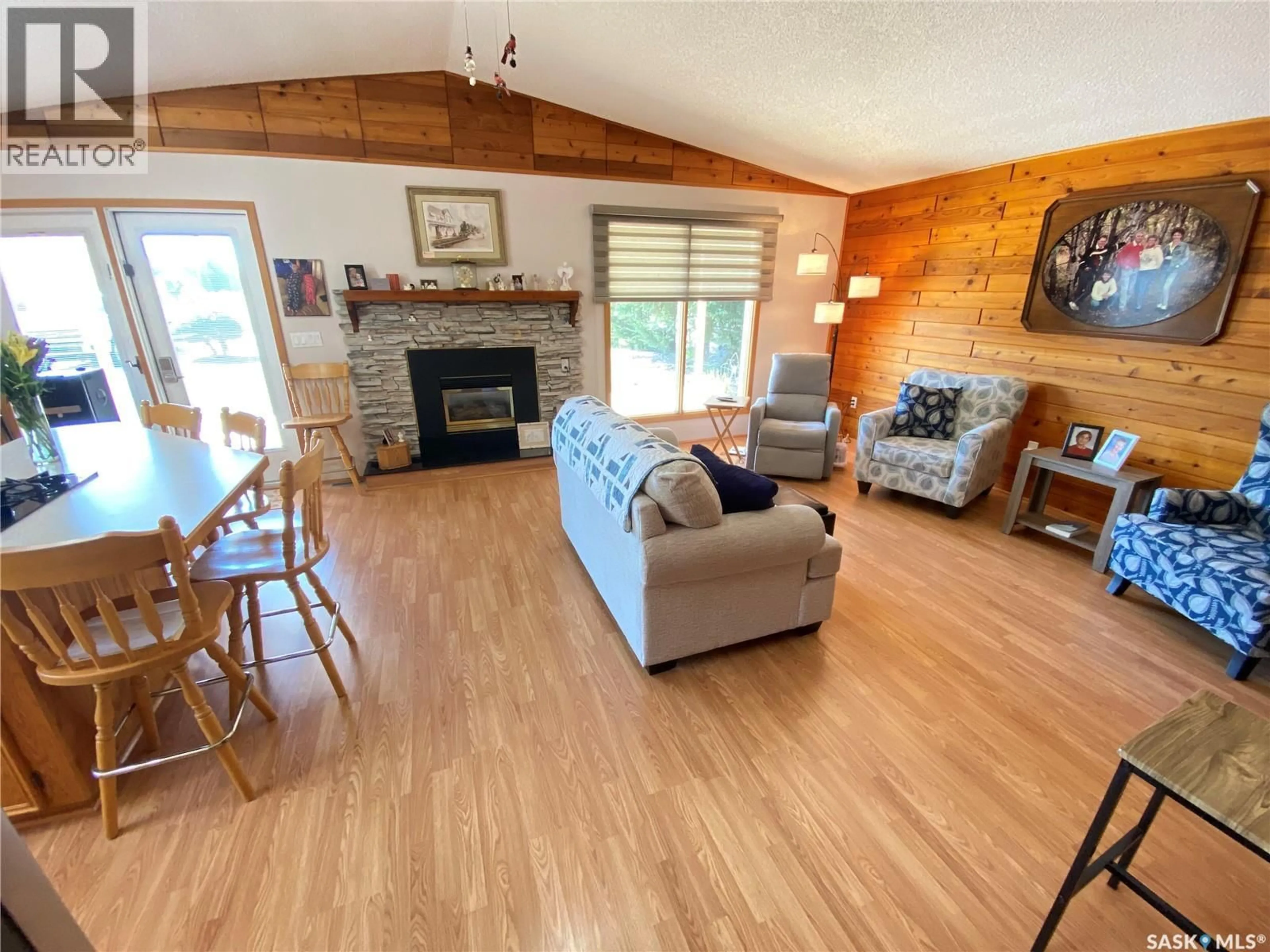 Living room with furniture, wood/laminate floor for 139 PEBBLE BEACH ROAD, Good Lake Rm No. 274 Saskatchewan S0A0L0