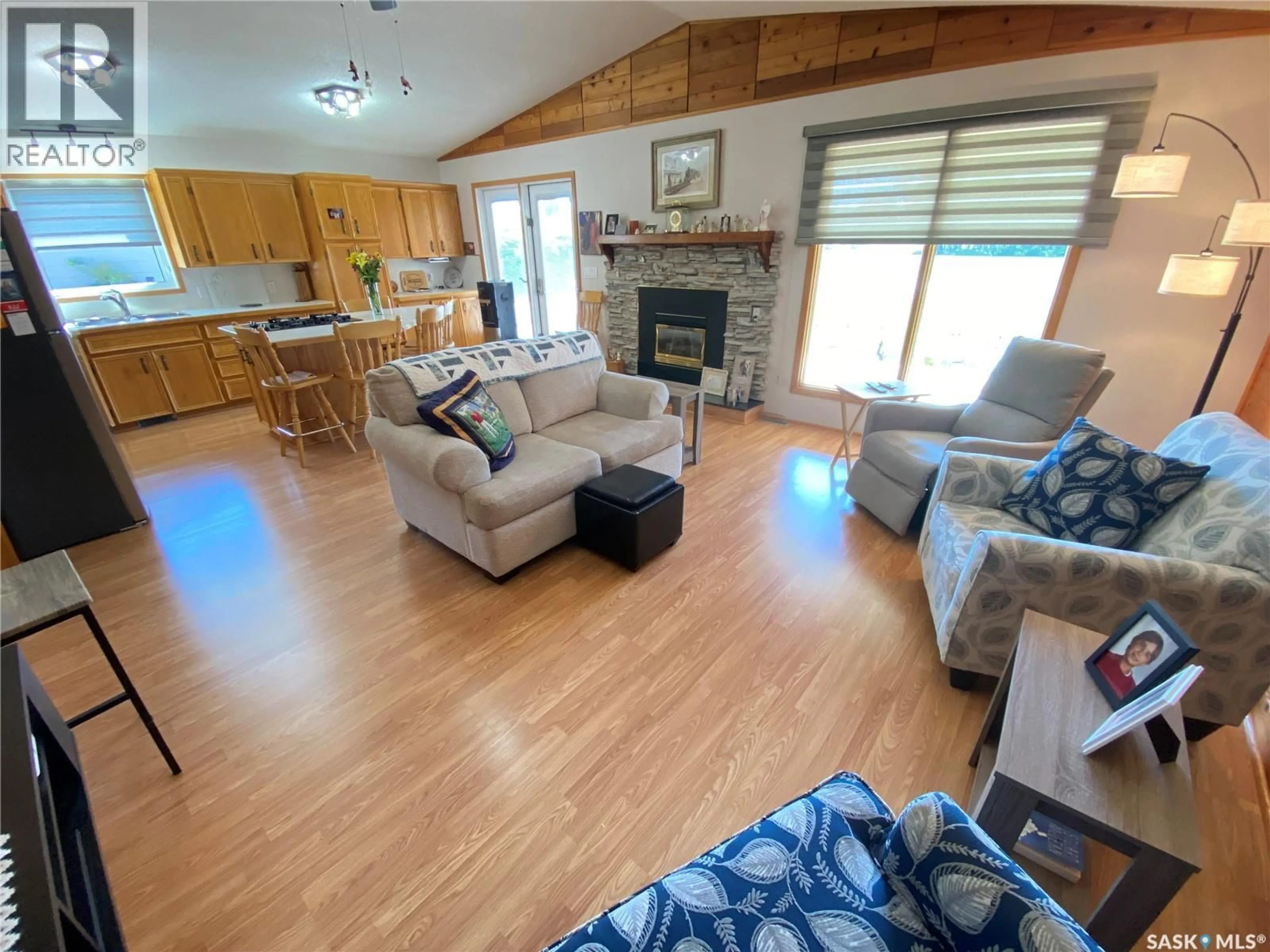 Living room with furniture, wood/laminate floor for 139 PEBBLE BEACH ROAD, Good Lake Rm No. 274 Saskatchewan S0A0L0