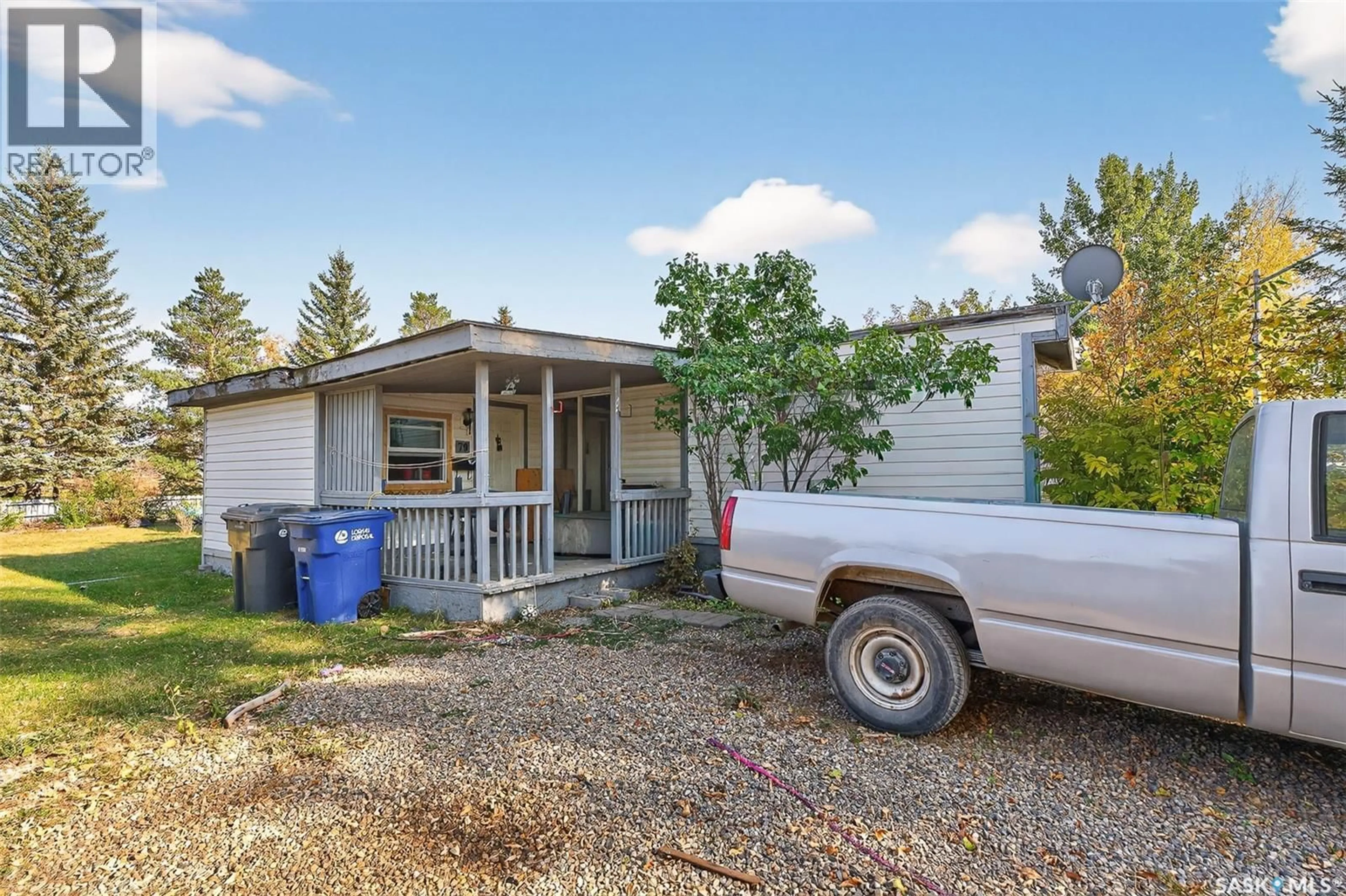 Home with vinyl exterior material, street for 79 SPRUCE STREET, Caronport Saskatchewan S0H0S0