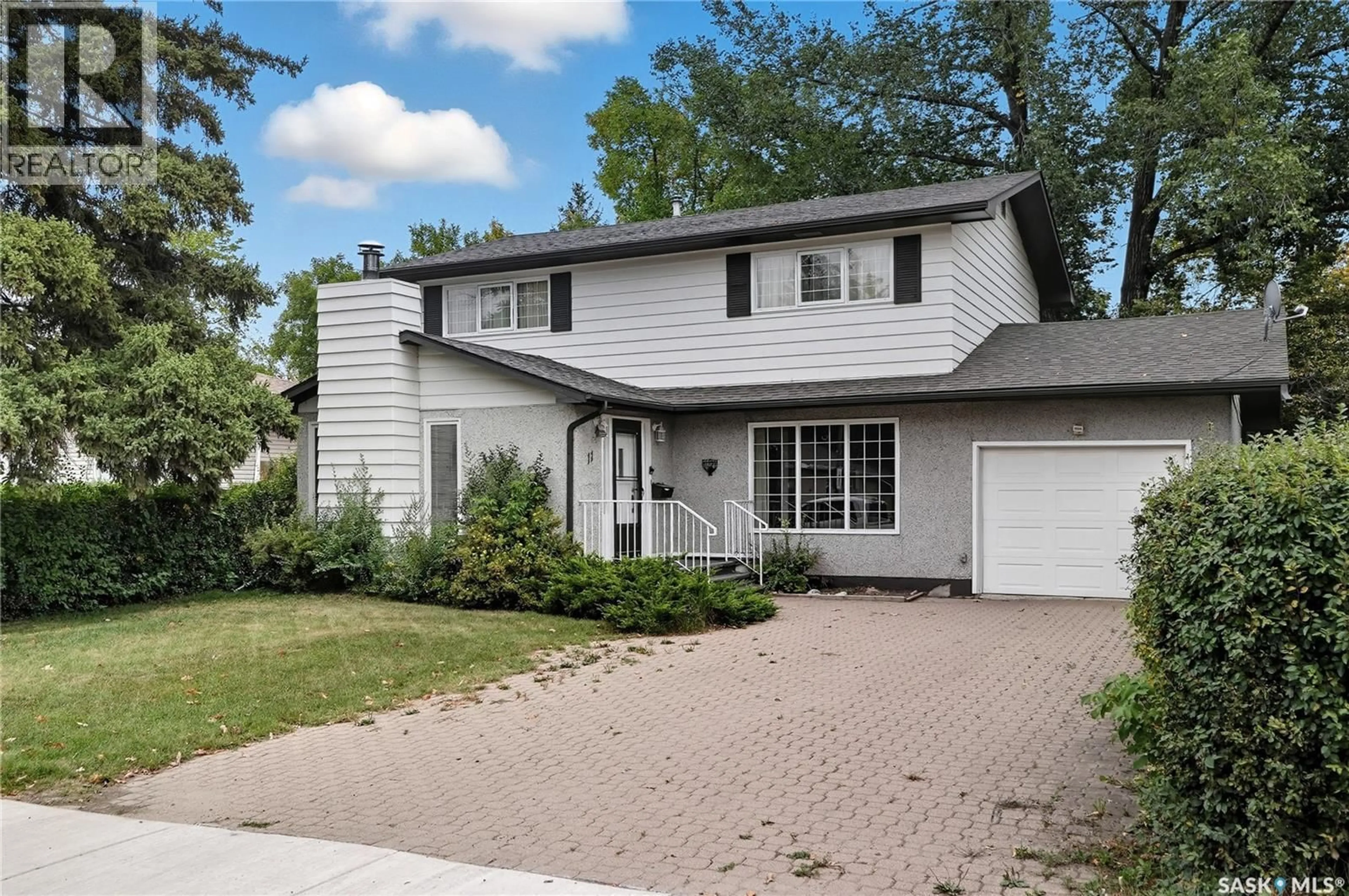 Home with vinyl exterior material, street for 11 MOXON CRESCENT, Saskatoon Saskatchewan S7H3B8