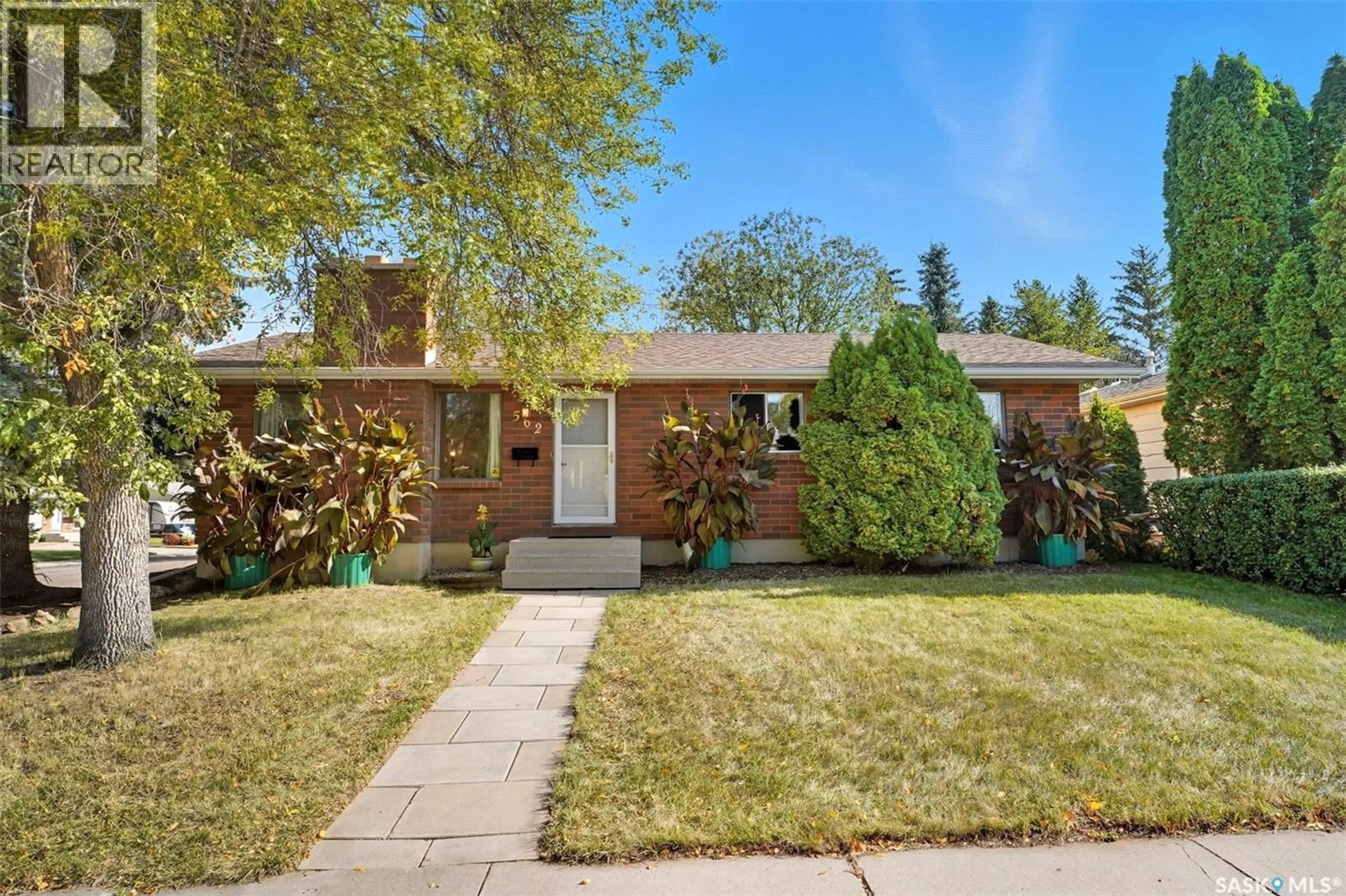 Home with brick exterior material, street for 562 HIGHLANDS TERRACE, Saskatoon Saskatchewan S7H4Y6