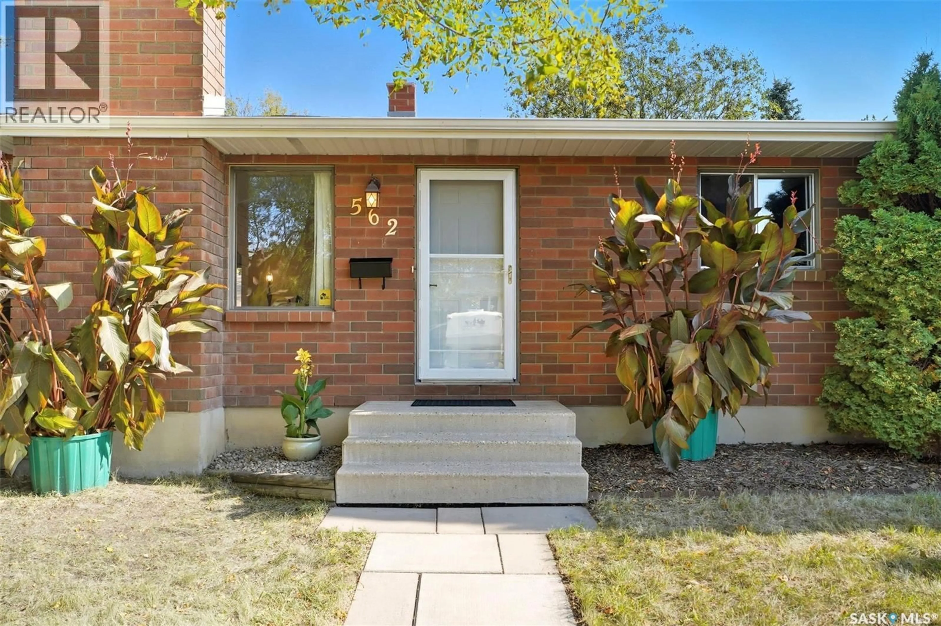 Home with brick exterior material, street for 562 HIGHLANDS TERRACE, Saskatoon Saskatchewan S7H4Y6