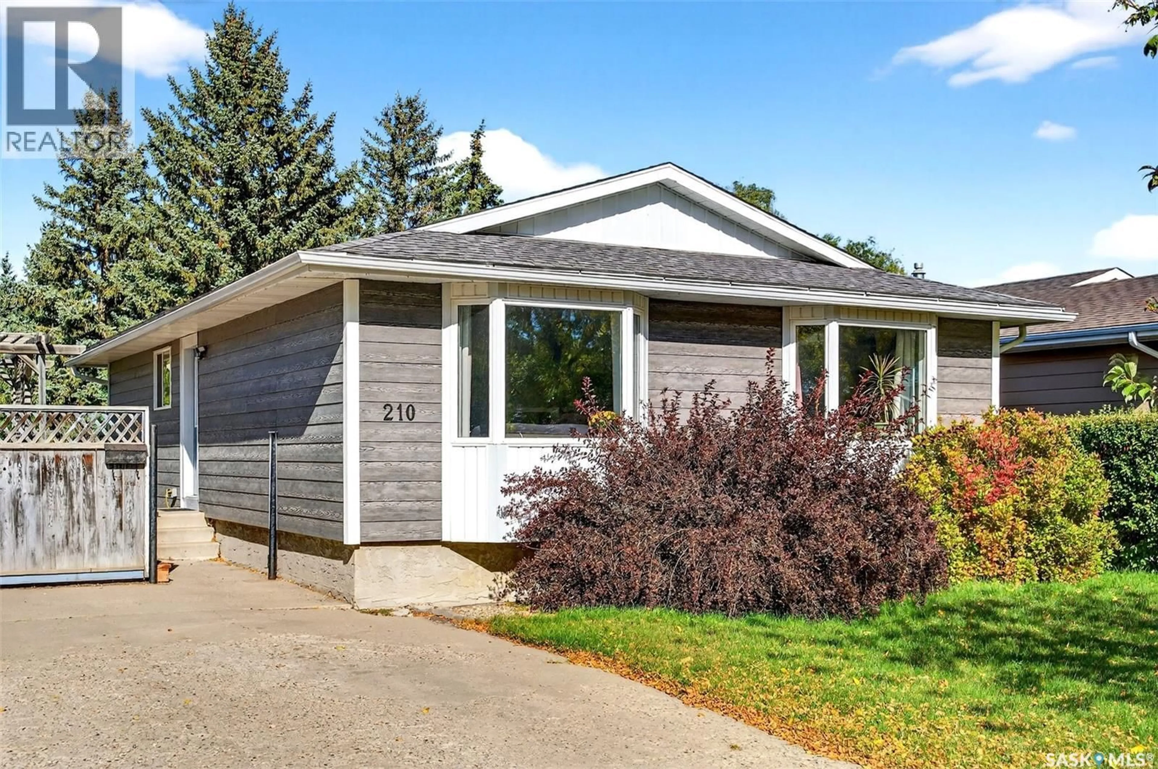 Home with vinyl exterior material, street for 210 CHURCH DRIVE, Regina Saskatchewan S4X1M1