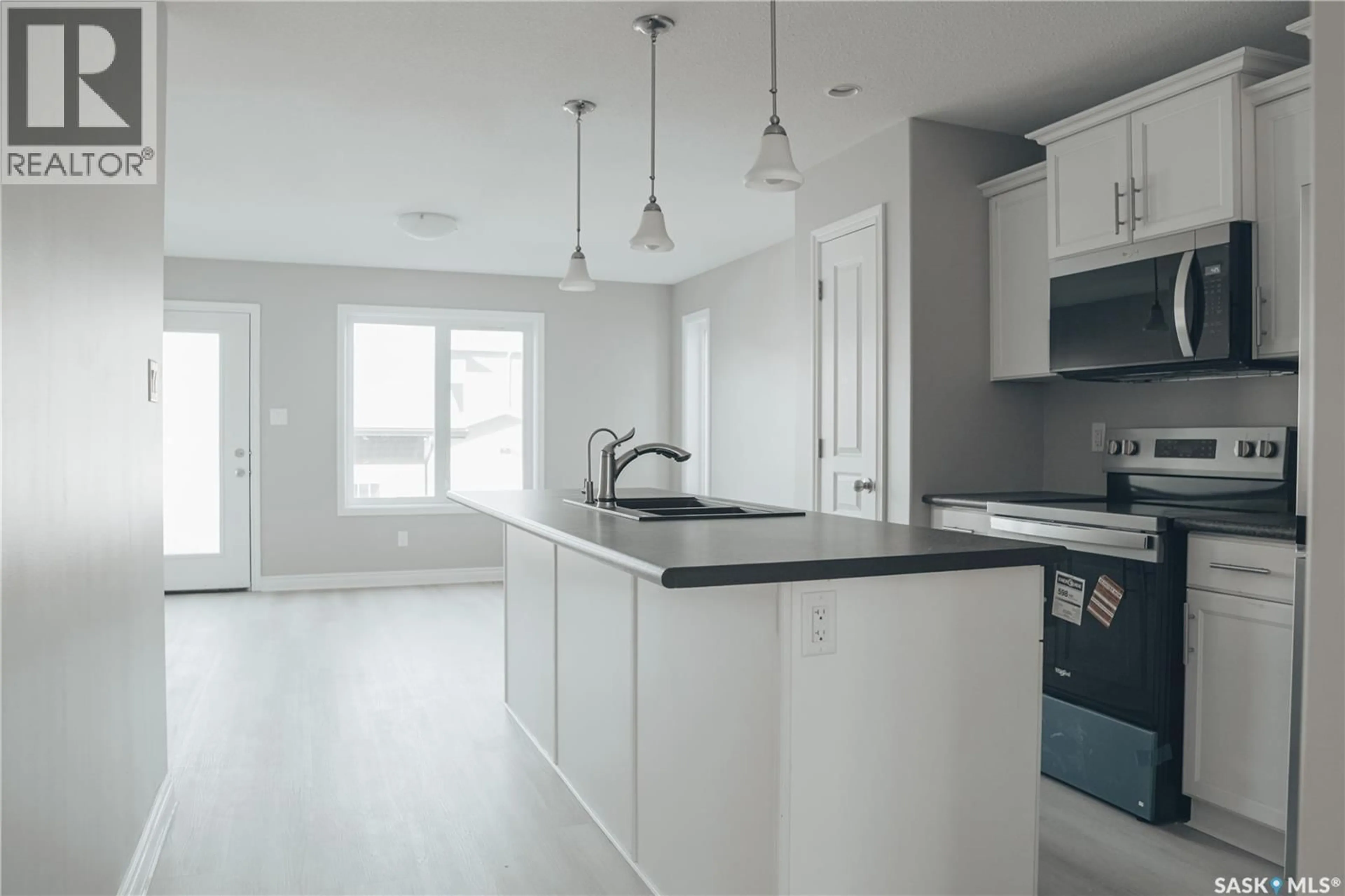 Open concept kitchen, ceramic/tile floor for 5426 MITCHINSON WAY, Regina Saskatchewan S4W0E7