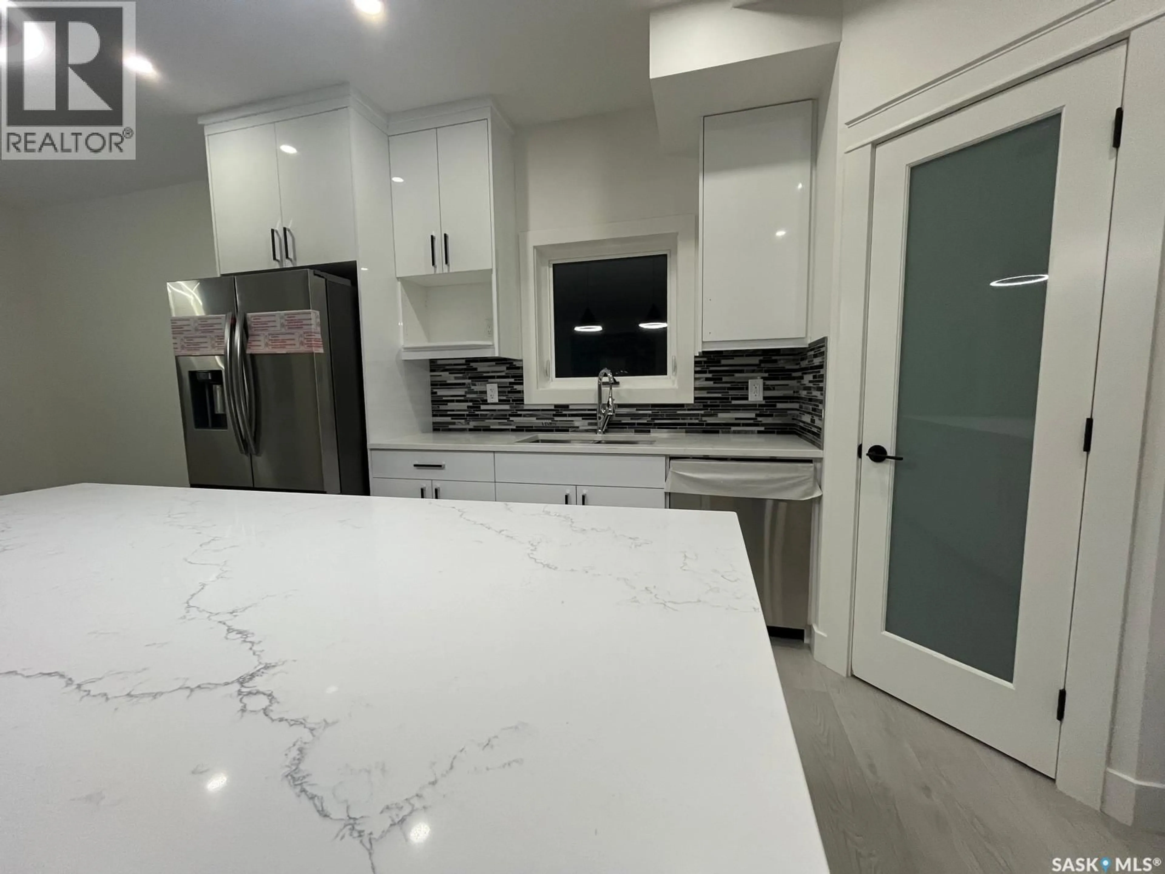 Open concept kitchen, ceramic/tile floor for 238 STROMBERG COURT, Saskatoon Saskatchewan S7L6M9
