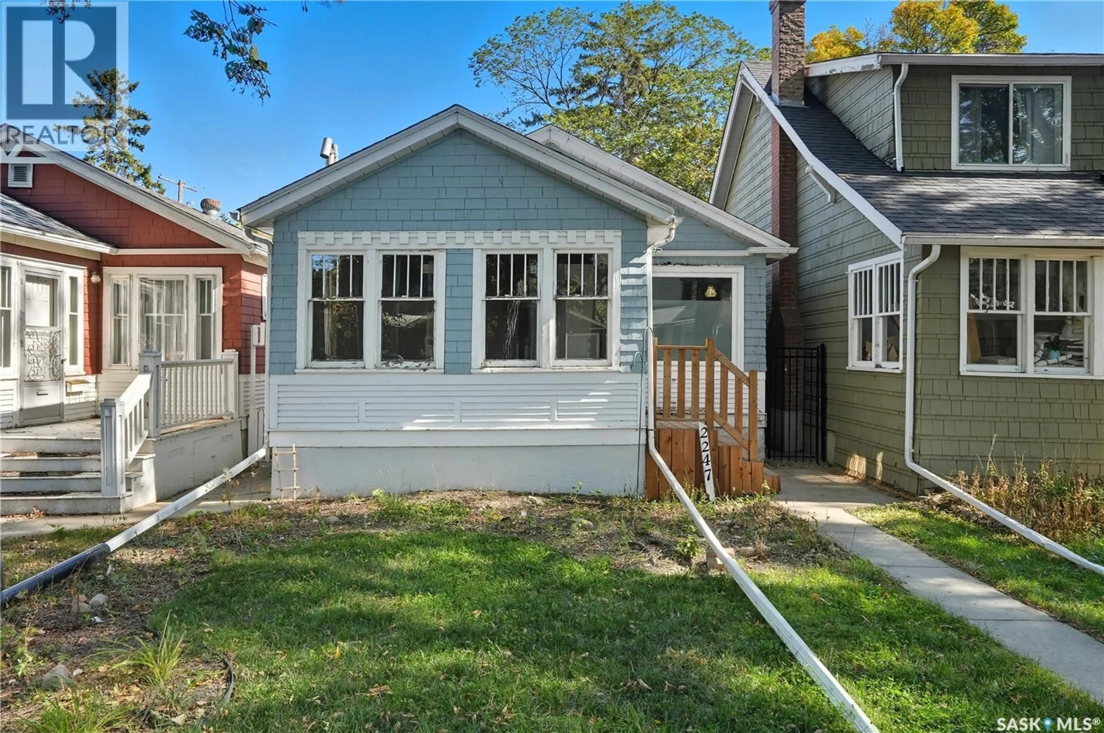 Home with vinyl exterior material, street for 2247 MONTREAL STREET, Regina Saskatchewan S4P1L7