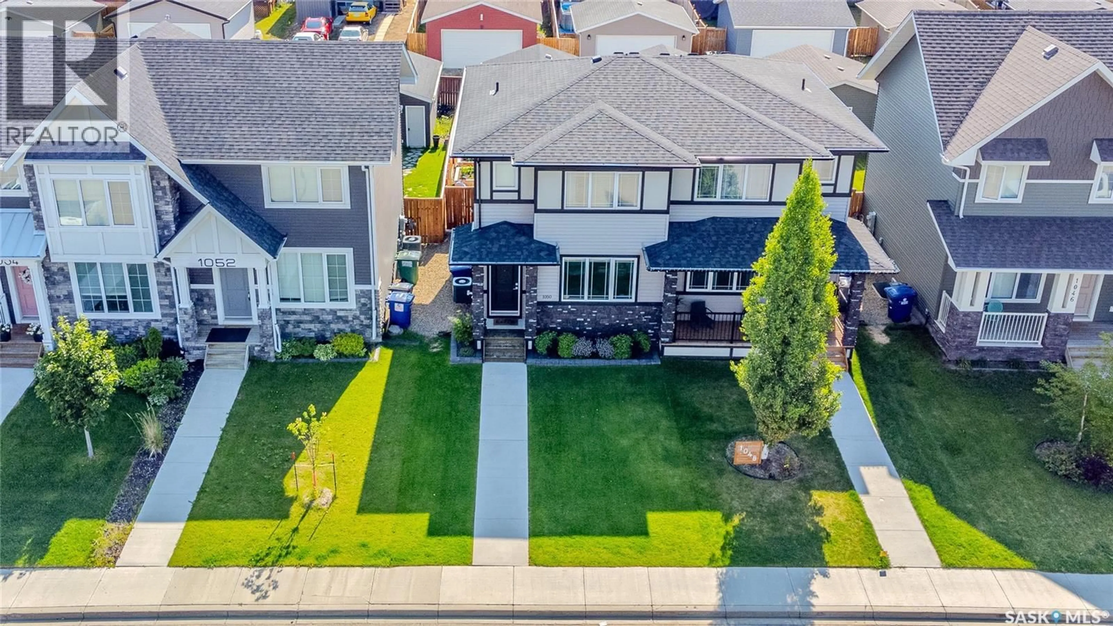 A pic from outside/outdoor area/front of a property/back of a property/a pic from drone, street for 1050 KOLYNCHUK CRESCENT, Saskatoon Saskatchewan S7T0X4