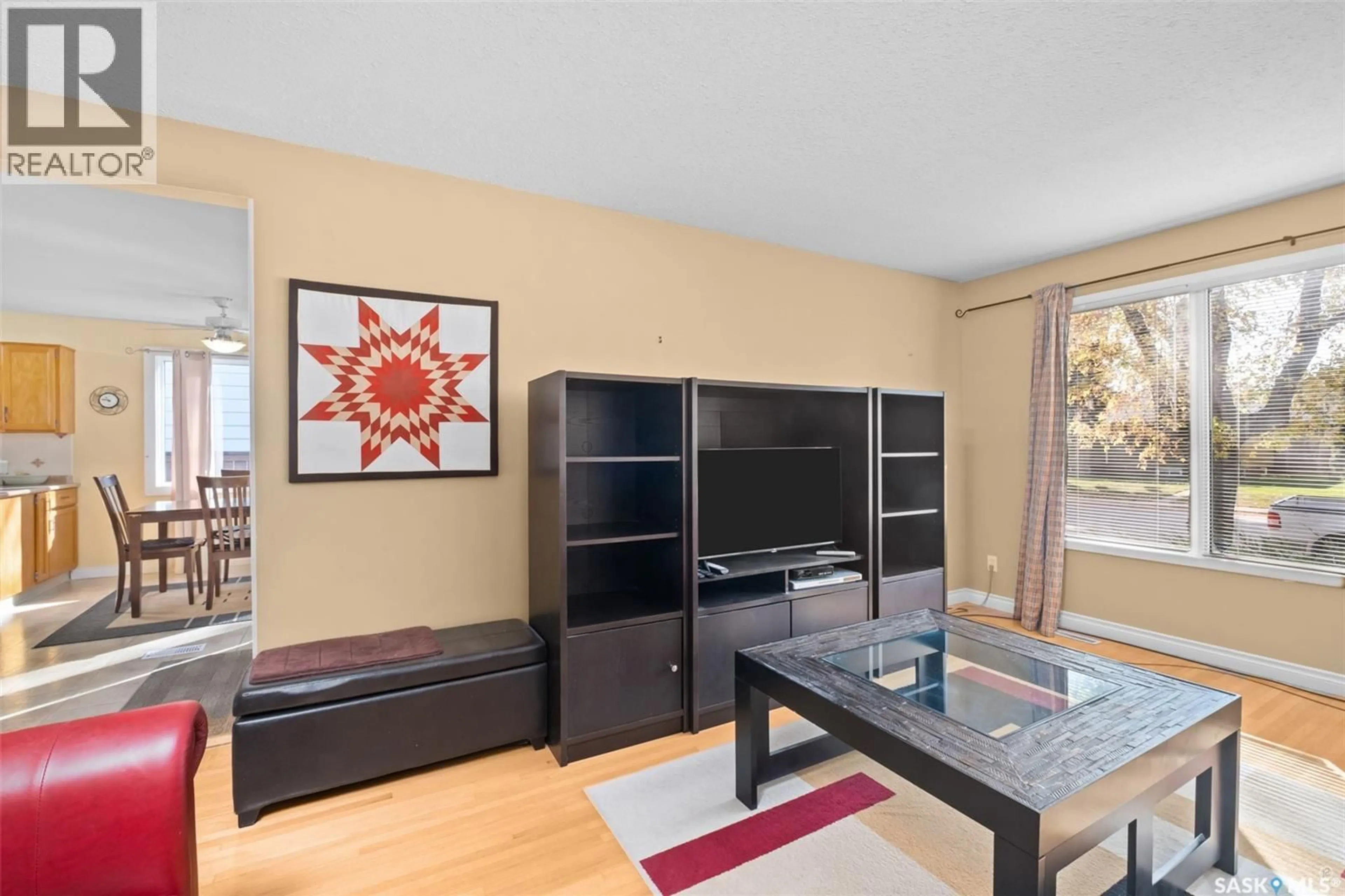 Living room with furniture, wood/laminate floor for 412 25TH STREET, Prince Albert Saskatchewan S6V4P7
