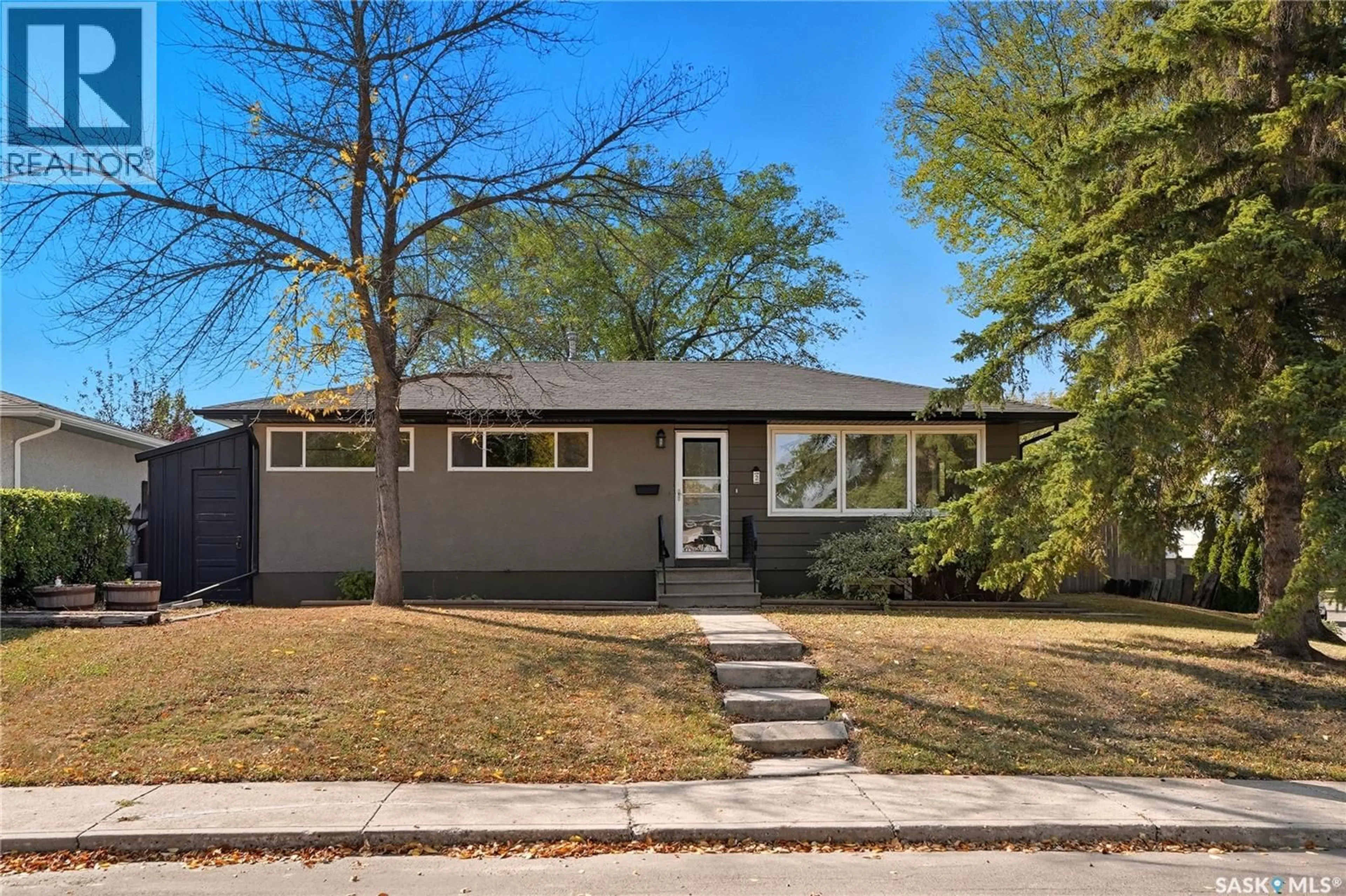 Home with vinyl exterior material, street for 2 YOUNG CRESCENT, Saskatoon Saskatchewan S7J2C4