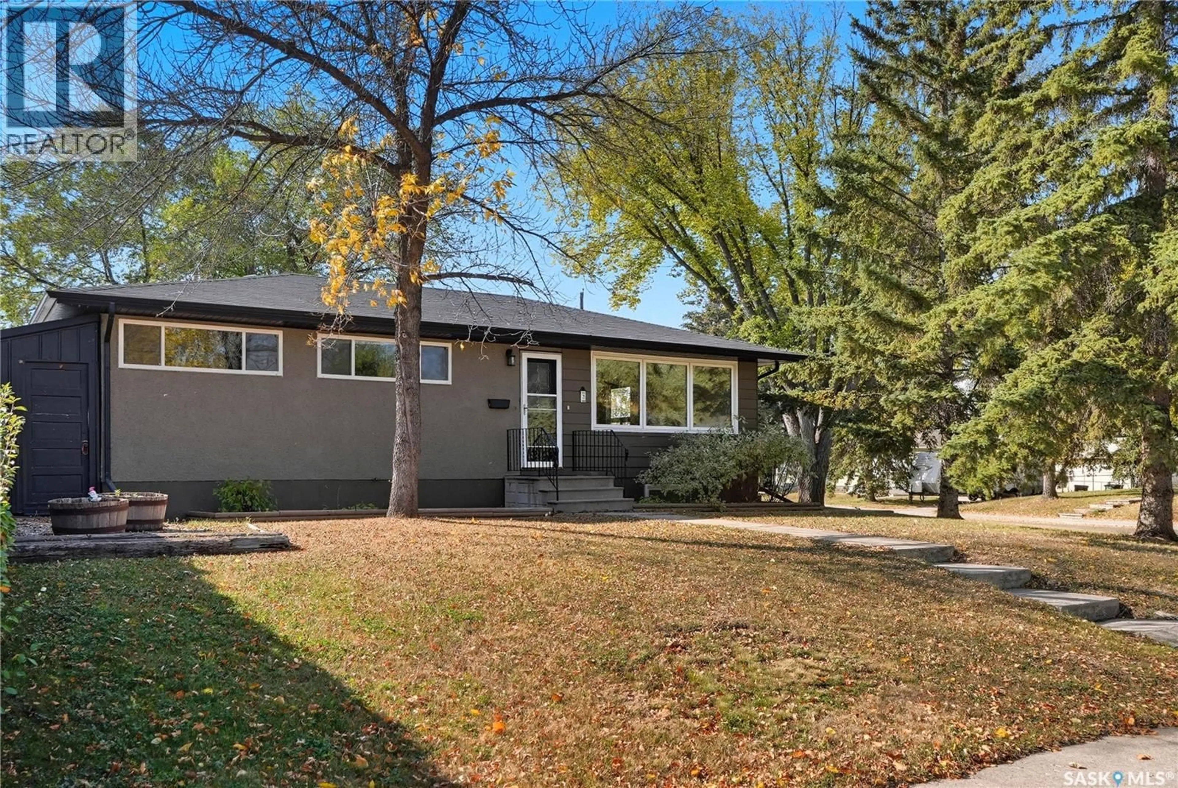 Home with vinyl exterior material, street for 2 YOUNG CRESCENT, Saskatoon Saskatchewan S7J2C4