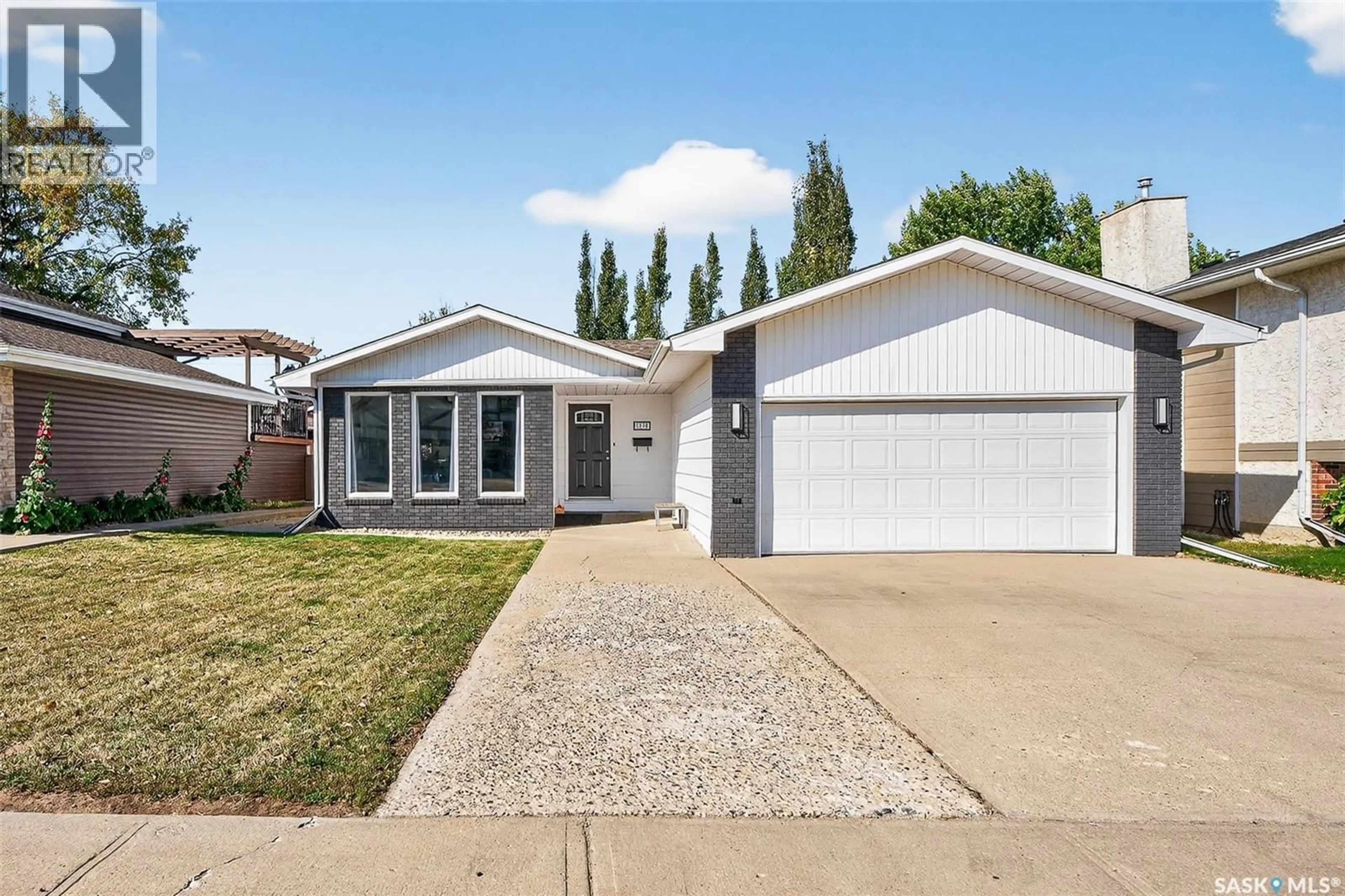 Home with vinyl exterior material, street for 1318 REGAL CRESCENT, Moose Jaw Saskatchewan S6H7S2
