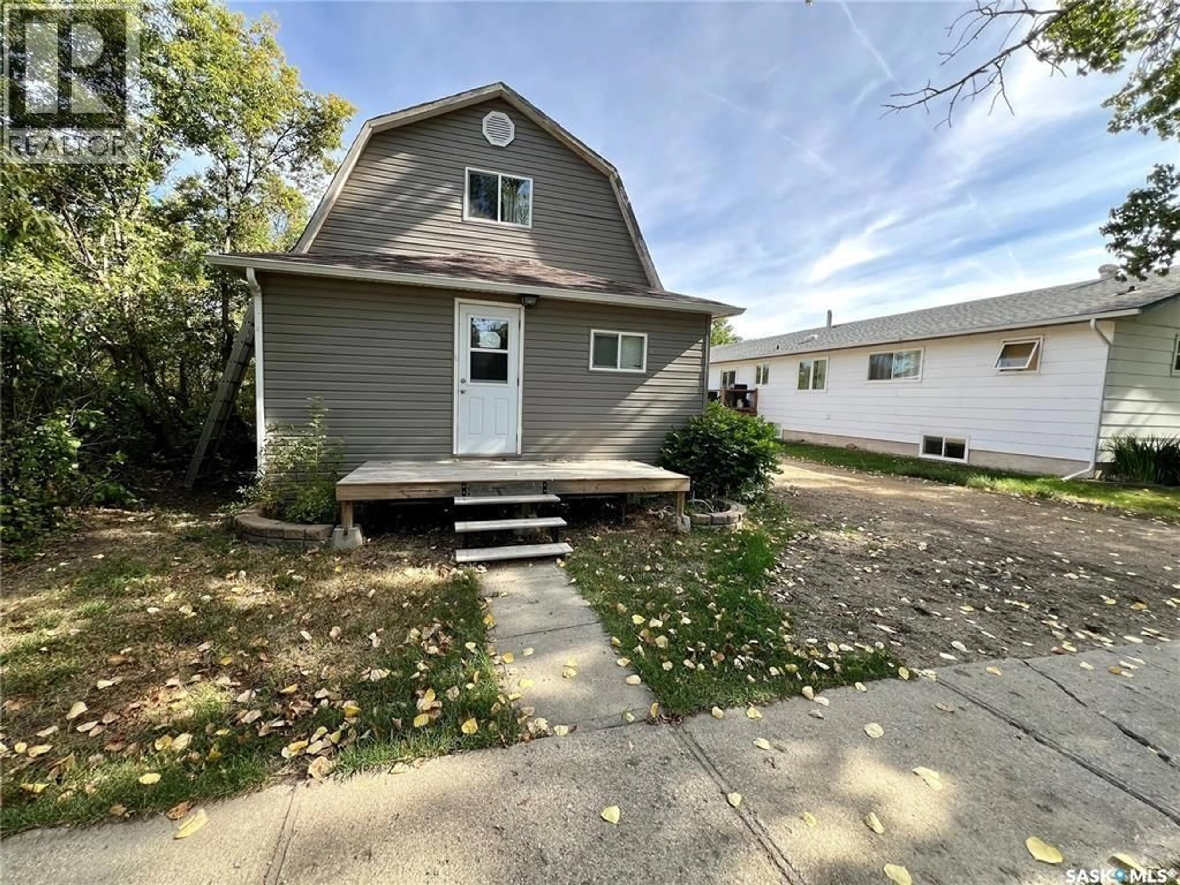 Home with vinyl exterior material, street for 82 3RD AVENUE, Central Butte Saskatchewan S0H0T0