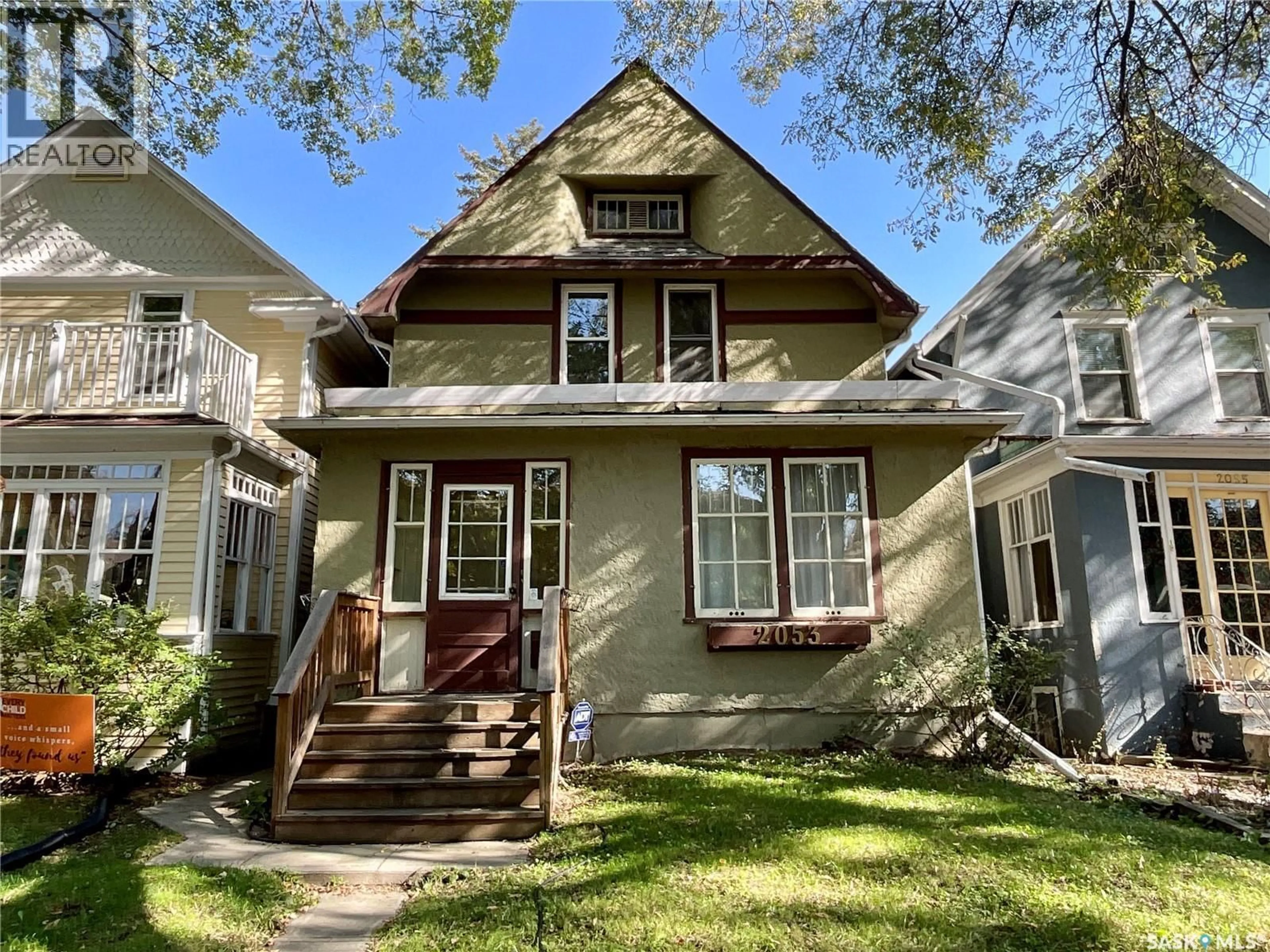 Home with vinyl exterior material, street for 2053 RAE STREET, Regina Saskatchewan S4T2E6