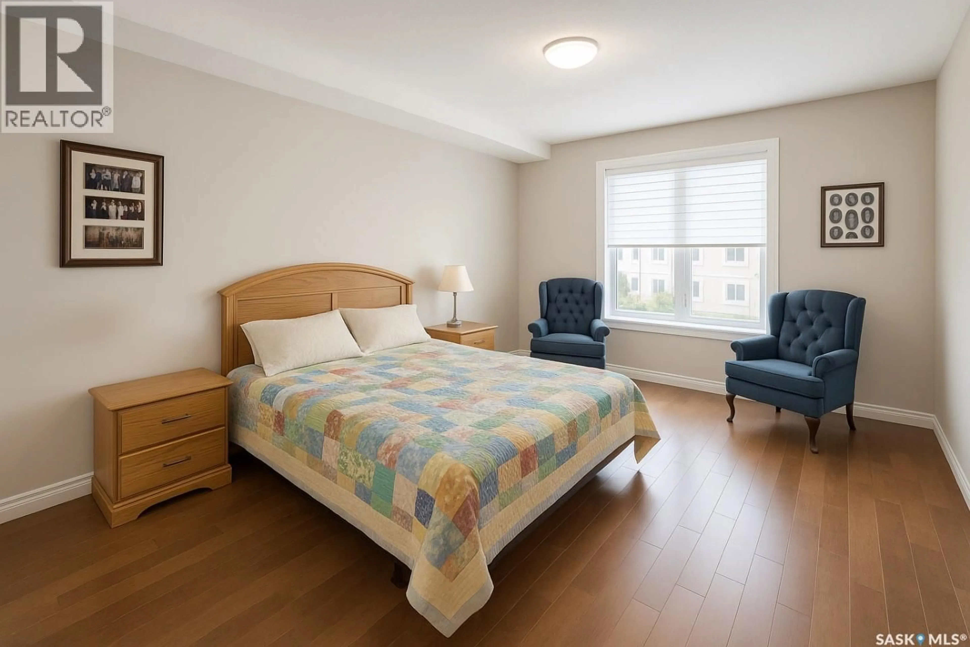 Bedroom with bed, wood/laminate floor for 1010 - 313 RUTH STREET, Saskatoon Saskatchewan S7J4M9