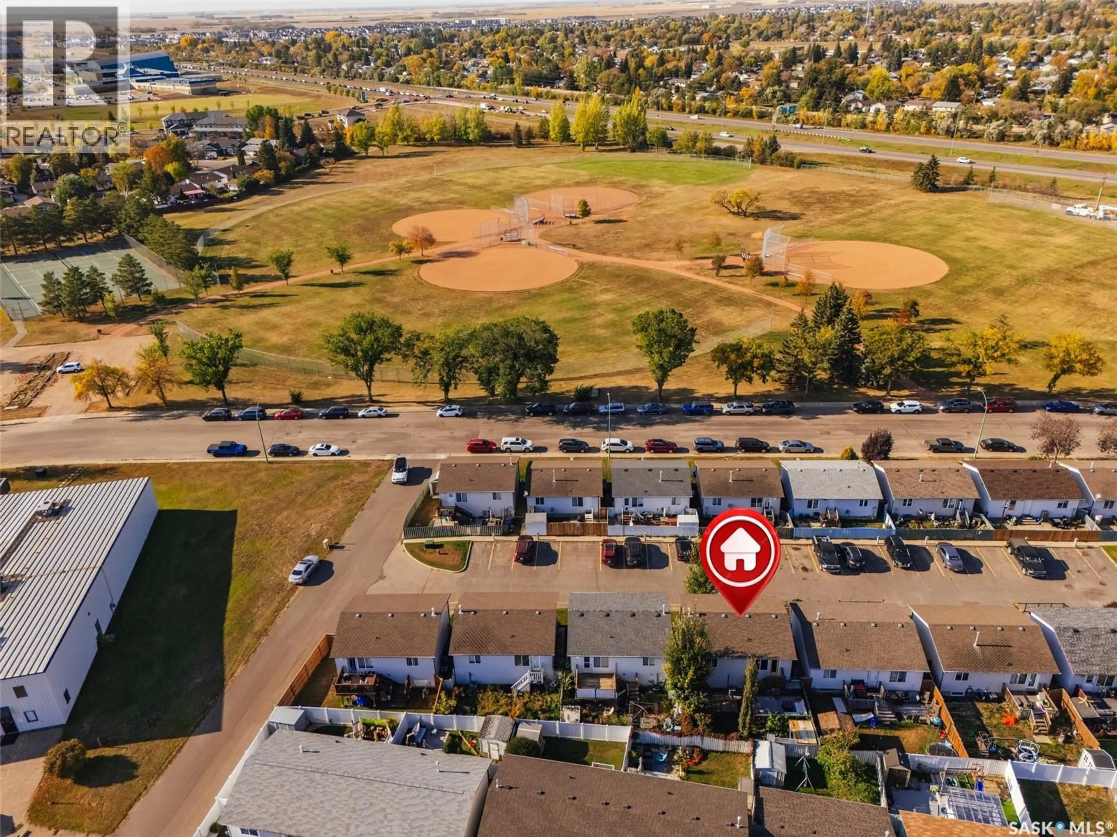 A pic from outside/outdoor area/front of a property/back of a property/a pic from drone, street for 13 143 GROPPER CRESCENT, Saskatoon Saskatchewan S7M5W2