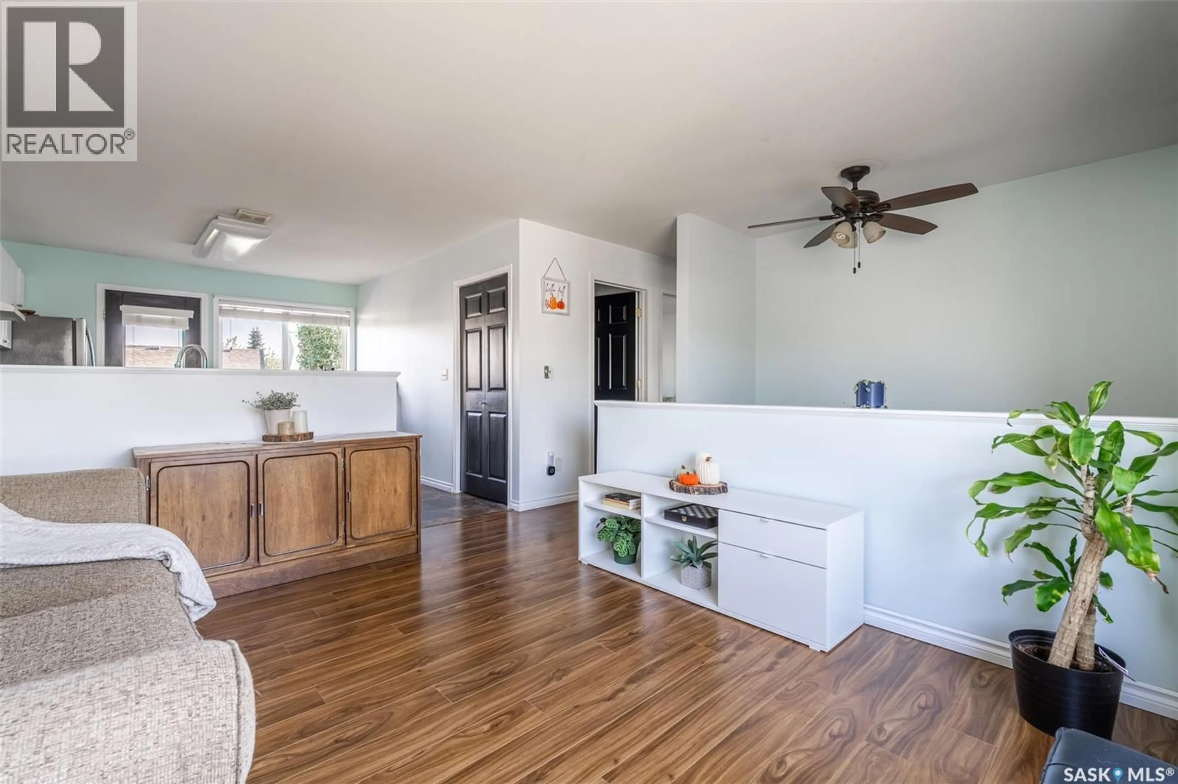 Open concept kitchen, wood/laminate floor for 13 143 GROPPER CRESCENT, Saskatoon Saskatchewan S7M5W2